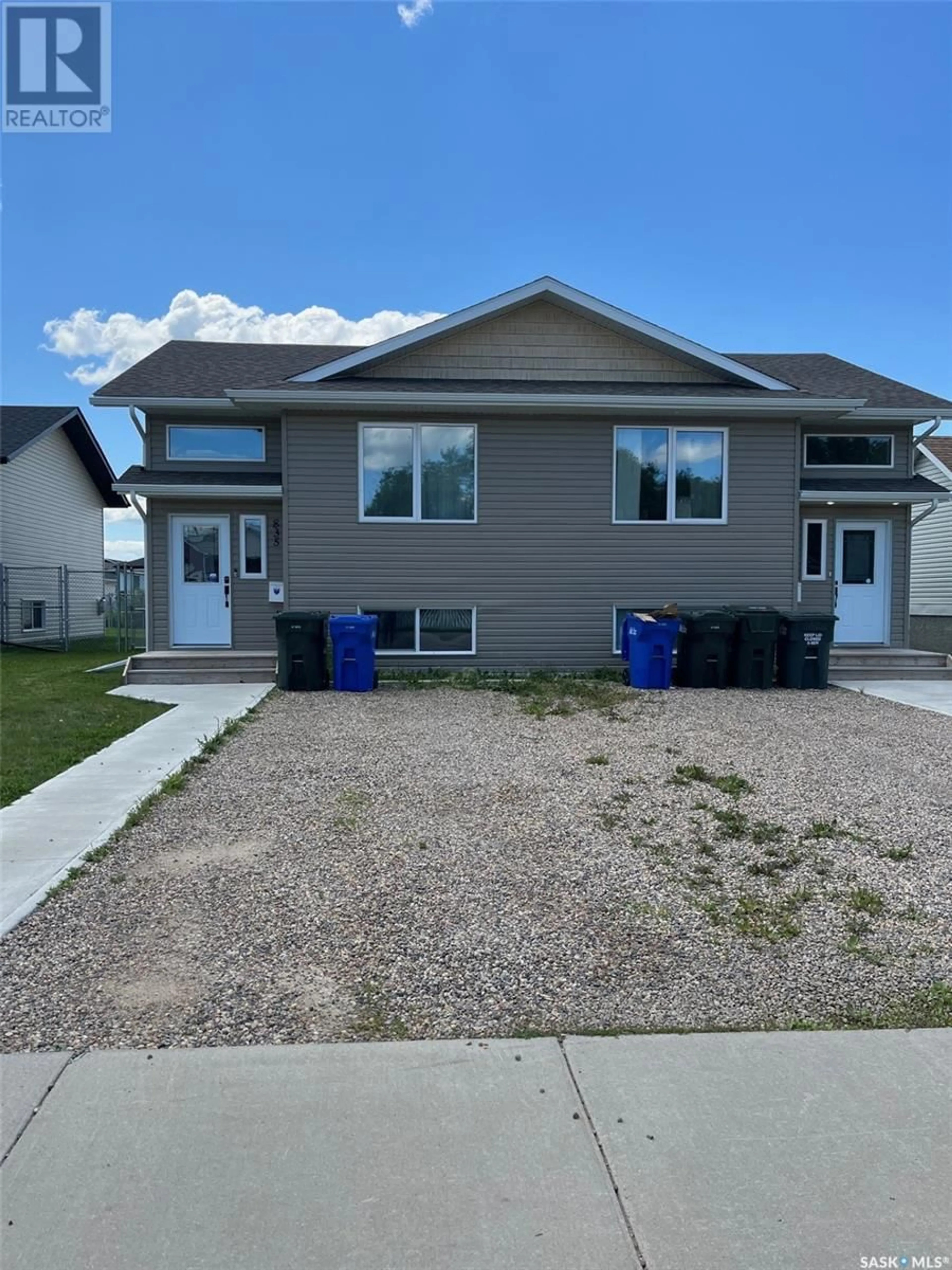 Home with vinyl exterior material, street for 833 & 835 5th STREET E, Prince Albert Saskatchewan S6V6N1