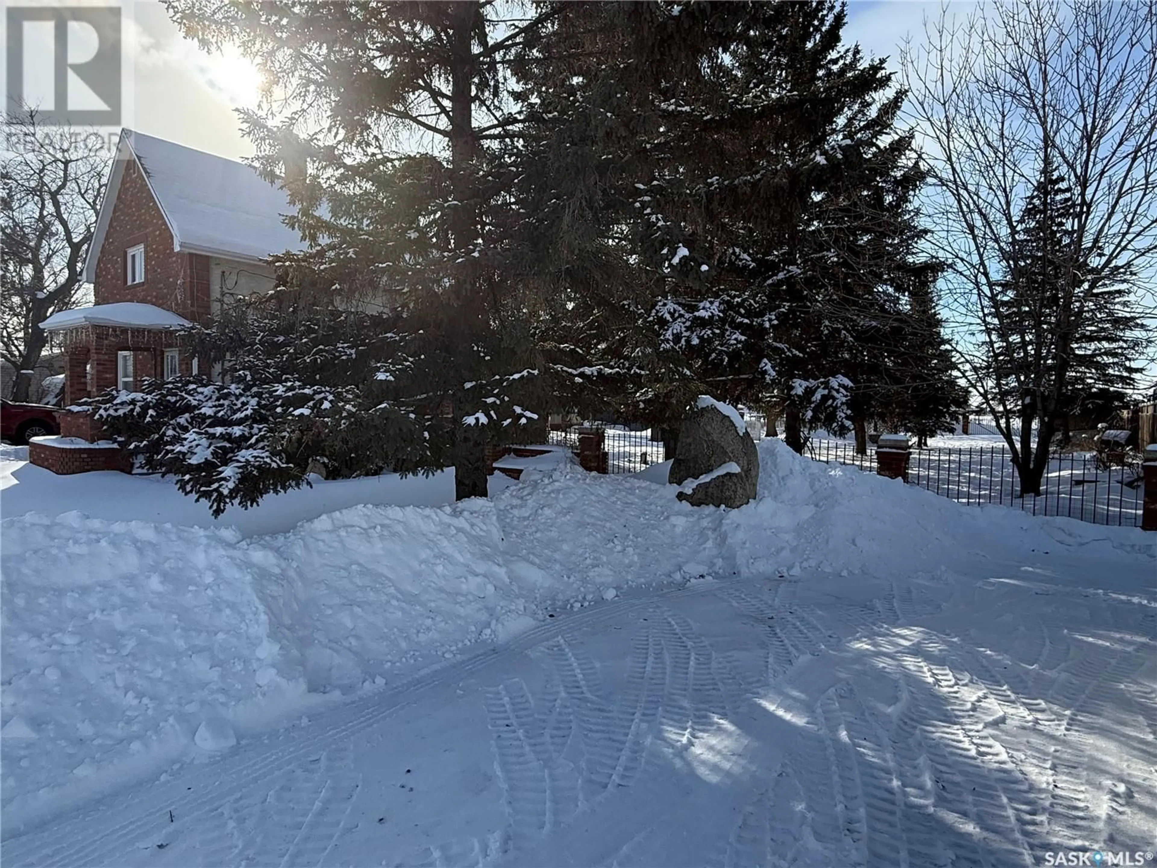 A pic from outside/outdoor area/front of a property/back of a property/a pic from drone, street for 419 Government ROAD N, Weyburn Saskatchewan S4H0P5