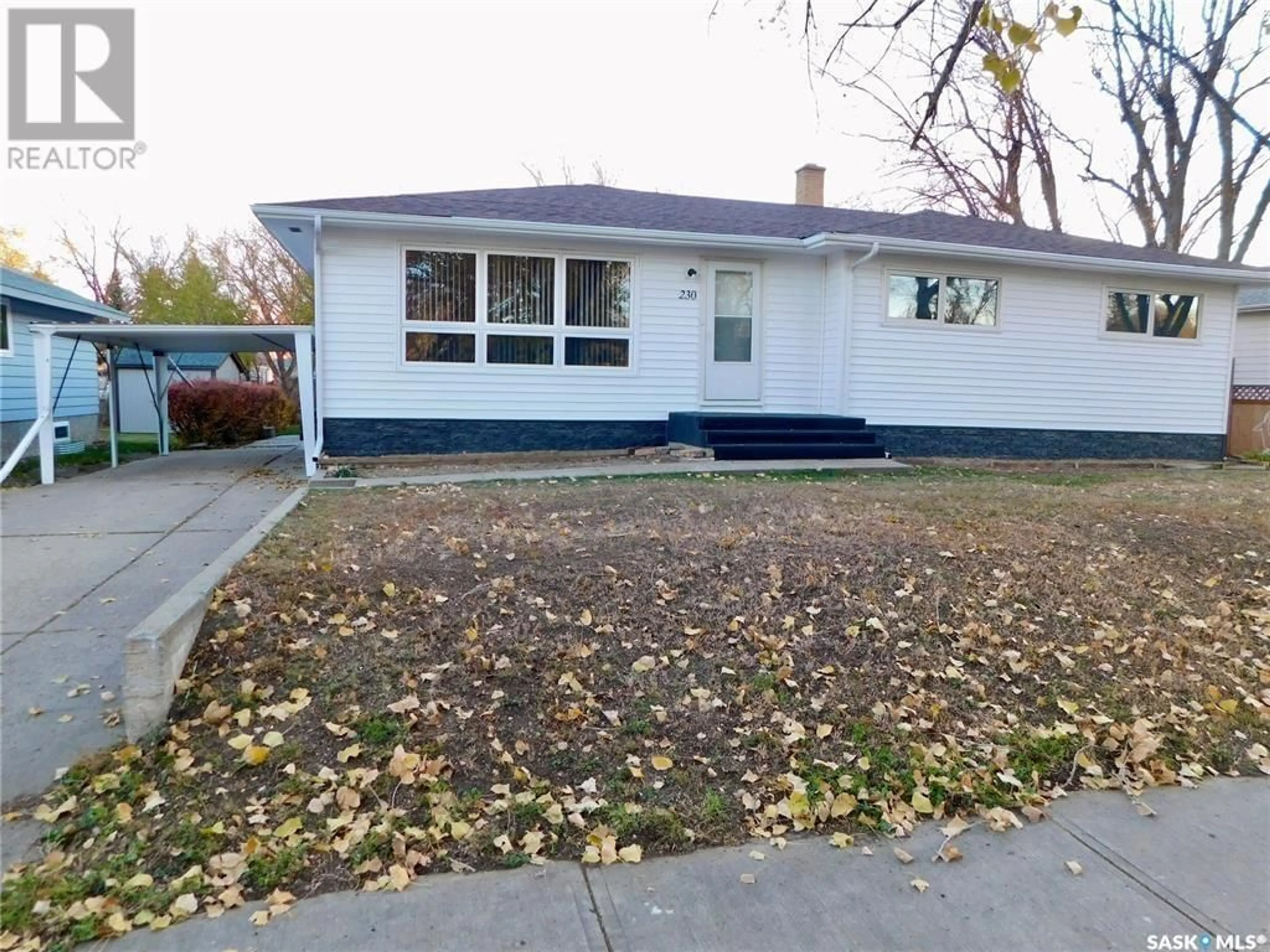 Home with vinyl exterior material, street for 230 3rd AVENUE W, Gravelbourg Saskatchewan S0H1X0