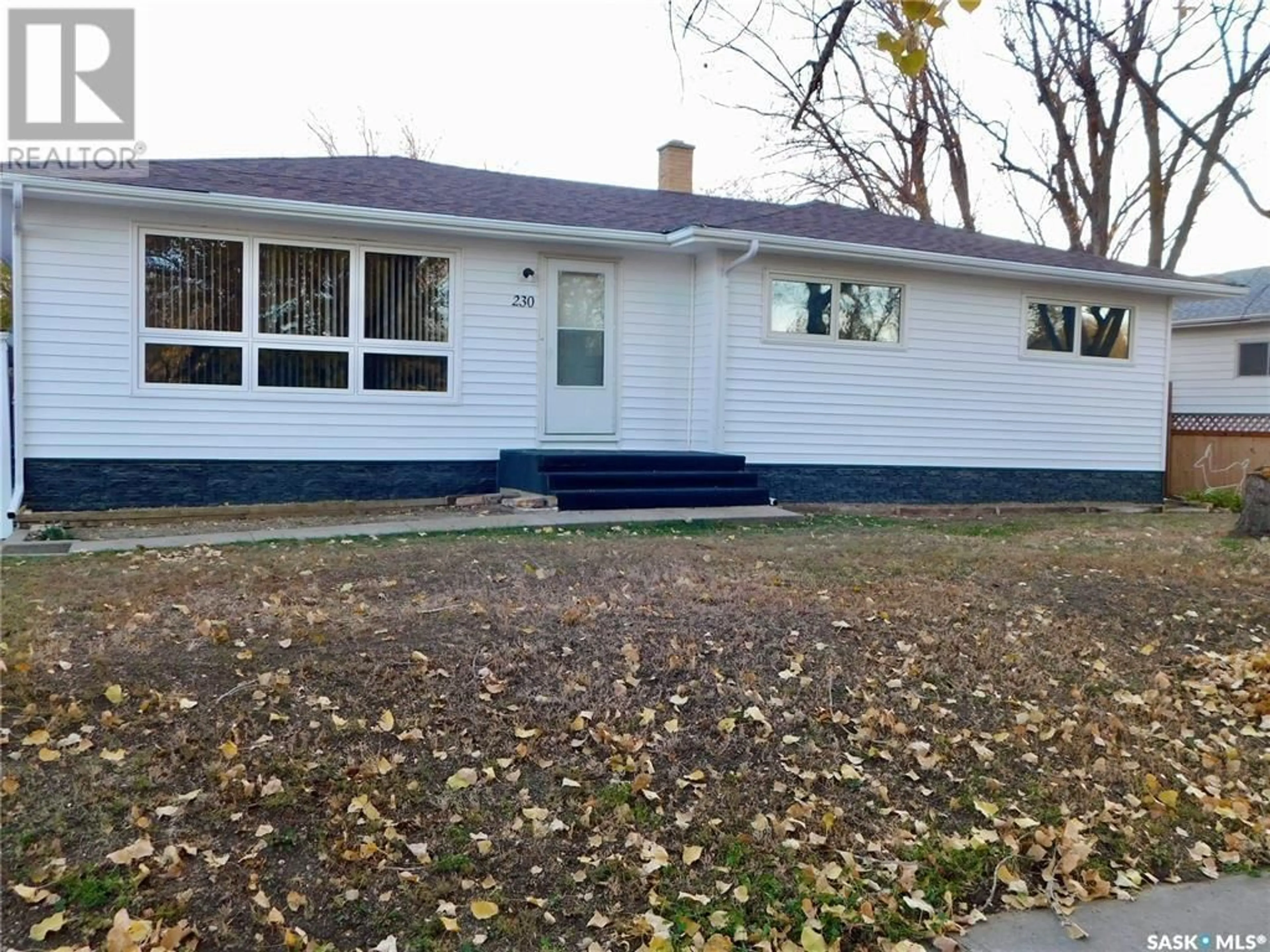 Home with vinyl exterior material, street for 230 3rd AVENUE W, Gravelbourg Saskatchewan S0H1X0