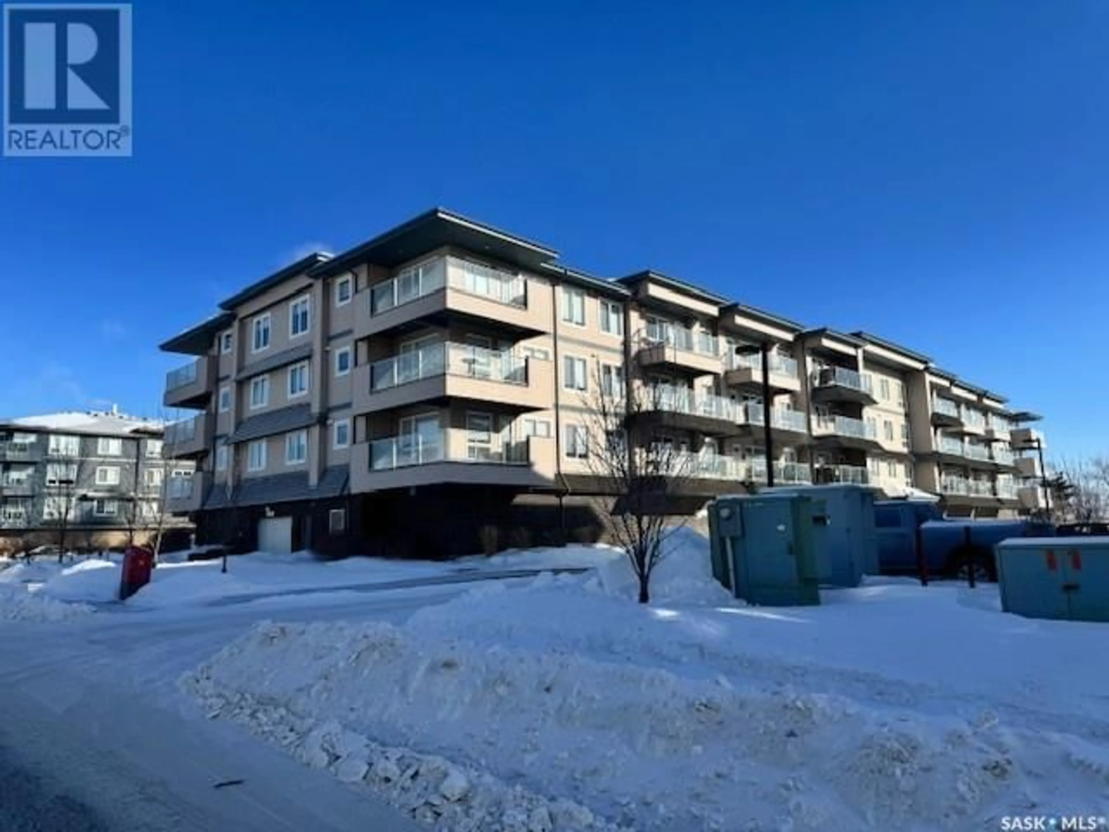 A pic from outside/outdoor area/front of a property/back of a property/a pic from drone, building for 303 2341 Windsor Park ROAD, Regina Saskatchewan S4V1R7