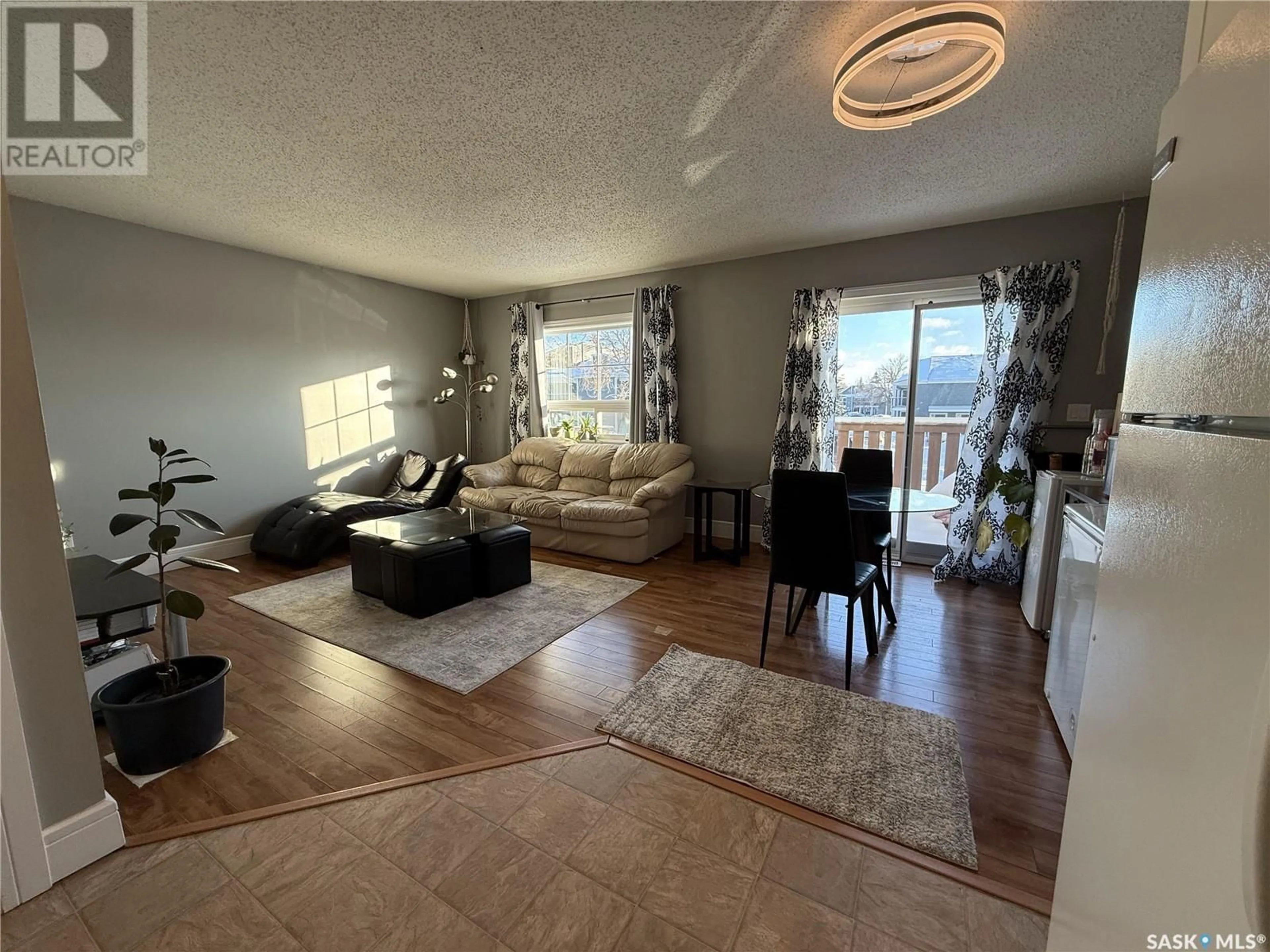 Living room with furniture, unknown for 540 Reid WAY, Saskatoon Saskatchewan S7N3J2