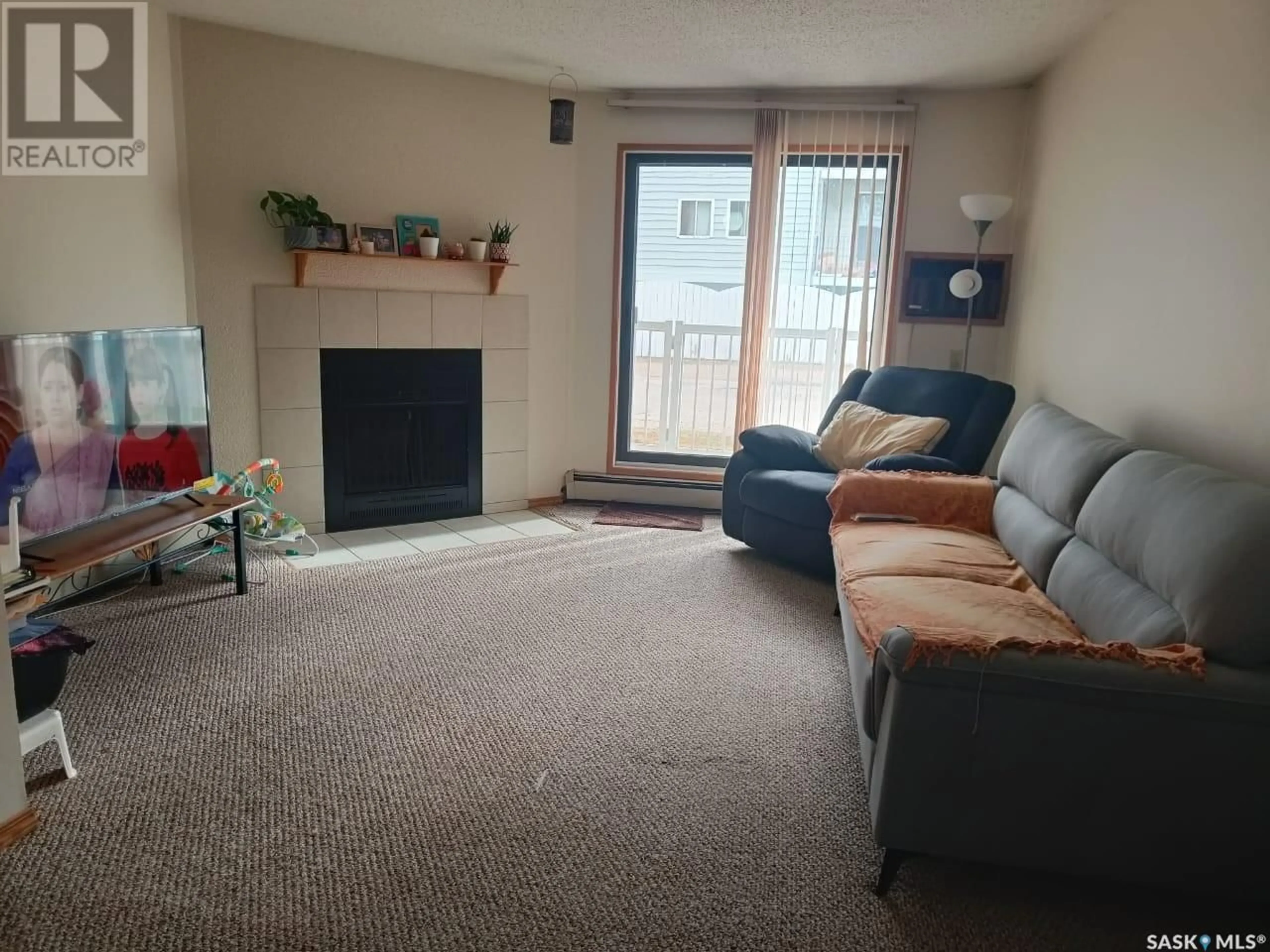 Living room with furniture, carpet floor for 108 51 Wood lily DRIVE, Moose Jaw Saskatchewan S6J1H1