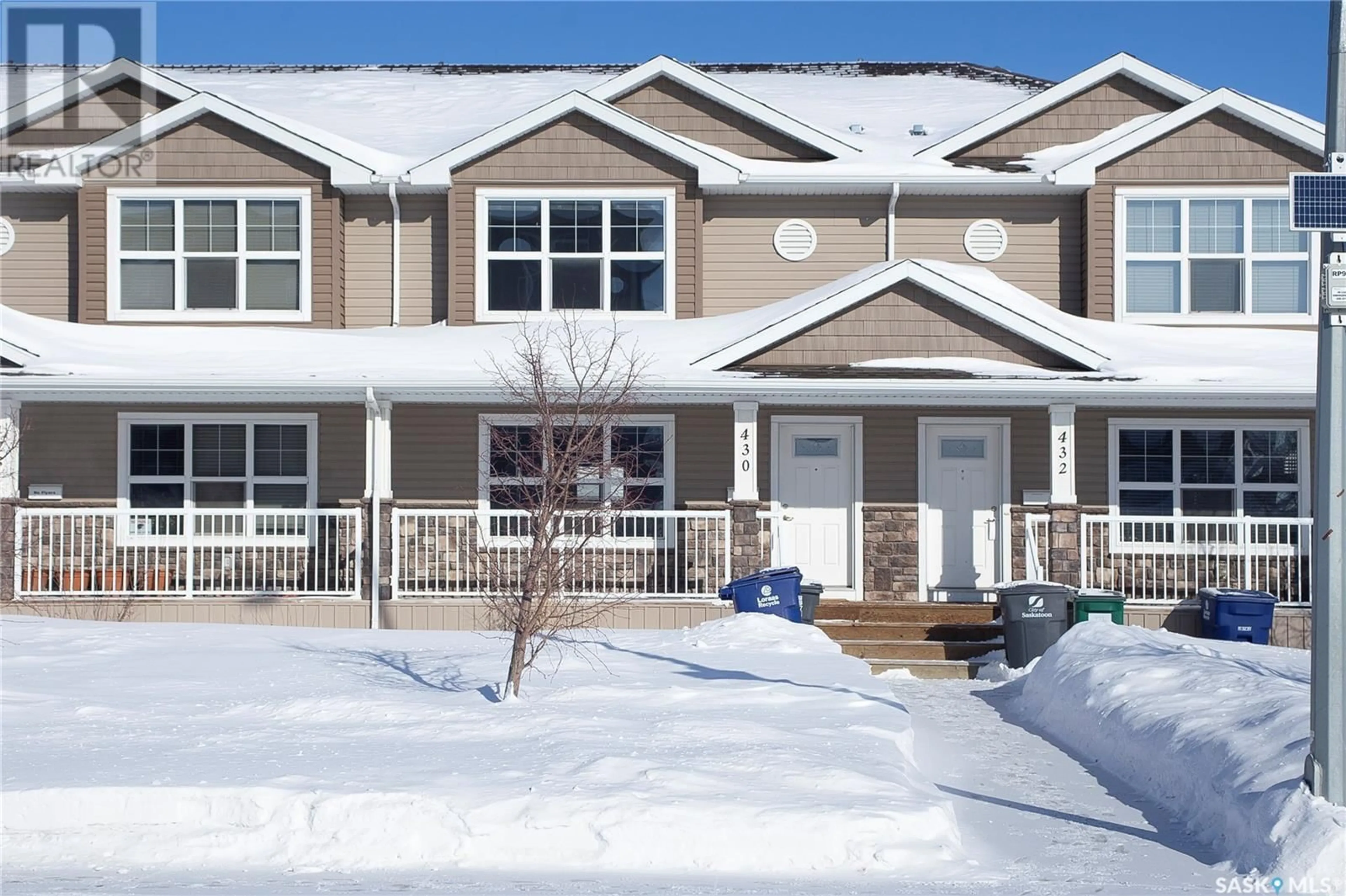 Home with vinyl exterior material, street for 430 Maningas BEND, Saskatoon Saskatchewan S7W0V6