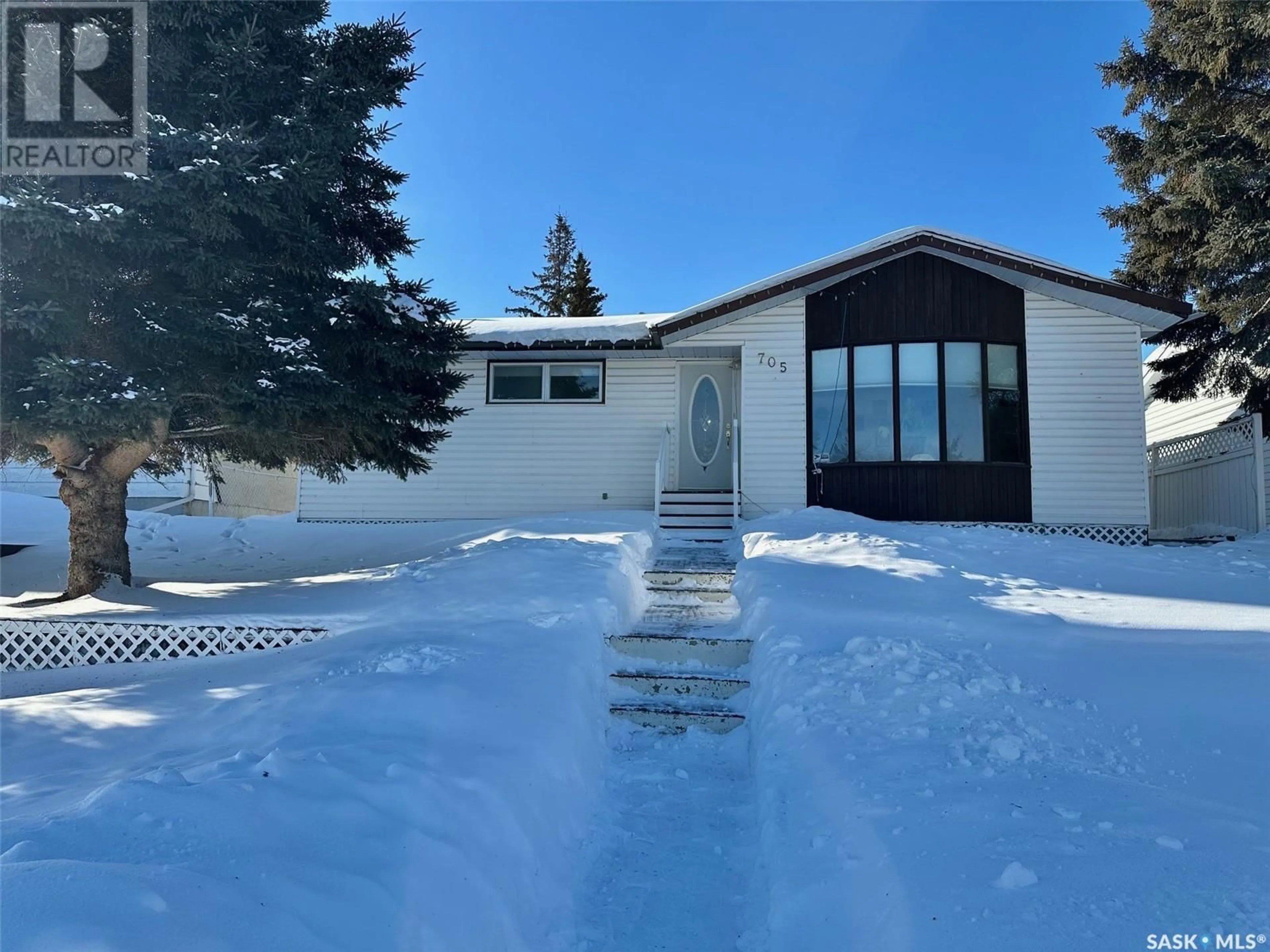 A pic from outside/outdoor area/front of a property/back of a property/a pic from drone, street for 705 Donald STREET, Hudson Bay Saskatchewan S0E0Y0