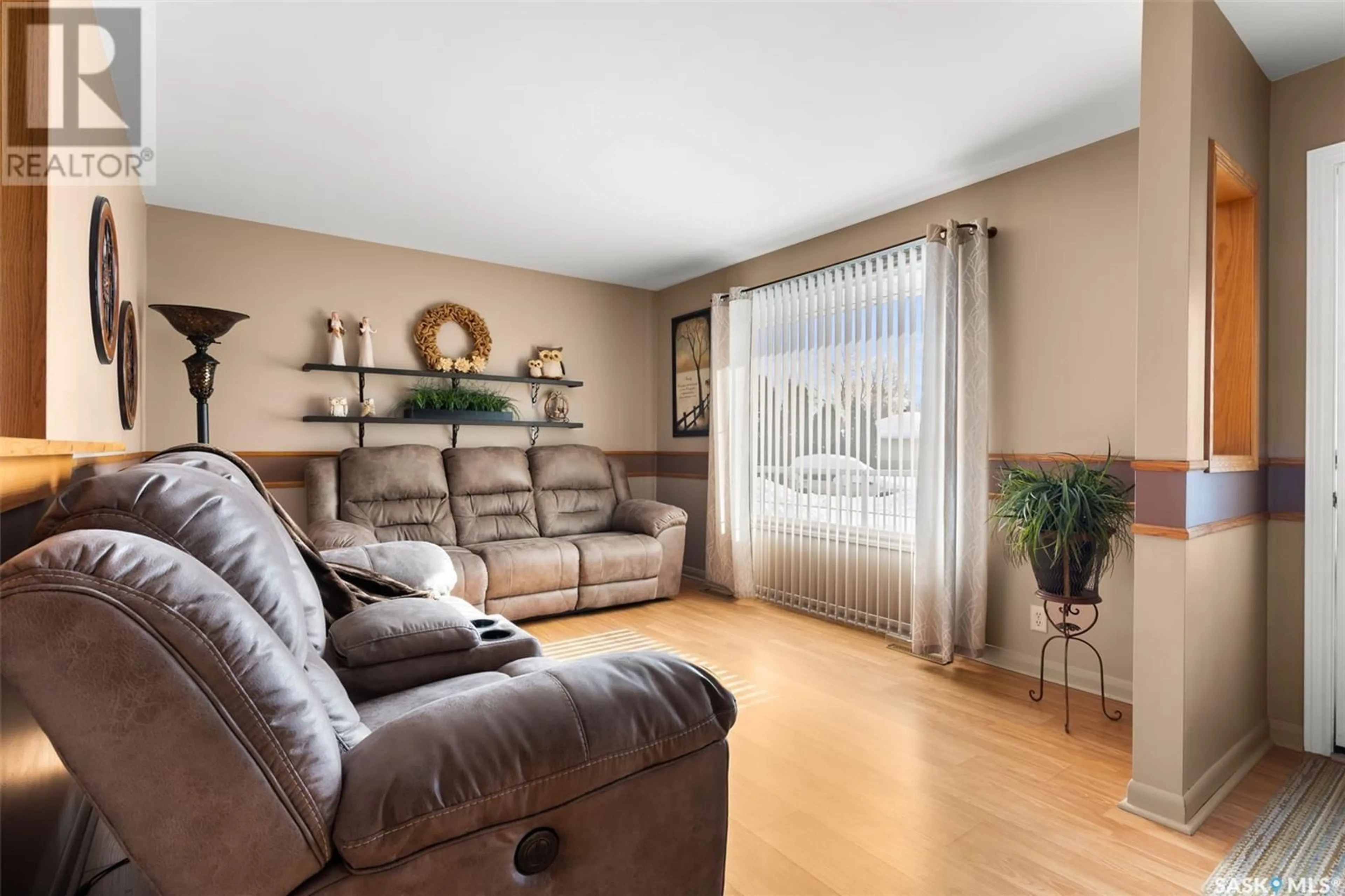 Living room with furniture, wood/laminate floor for 310 Royal STREET, Regina Saskatchewan S4R4Y1