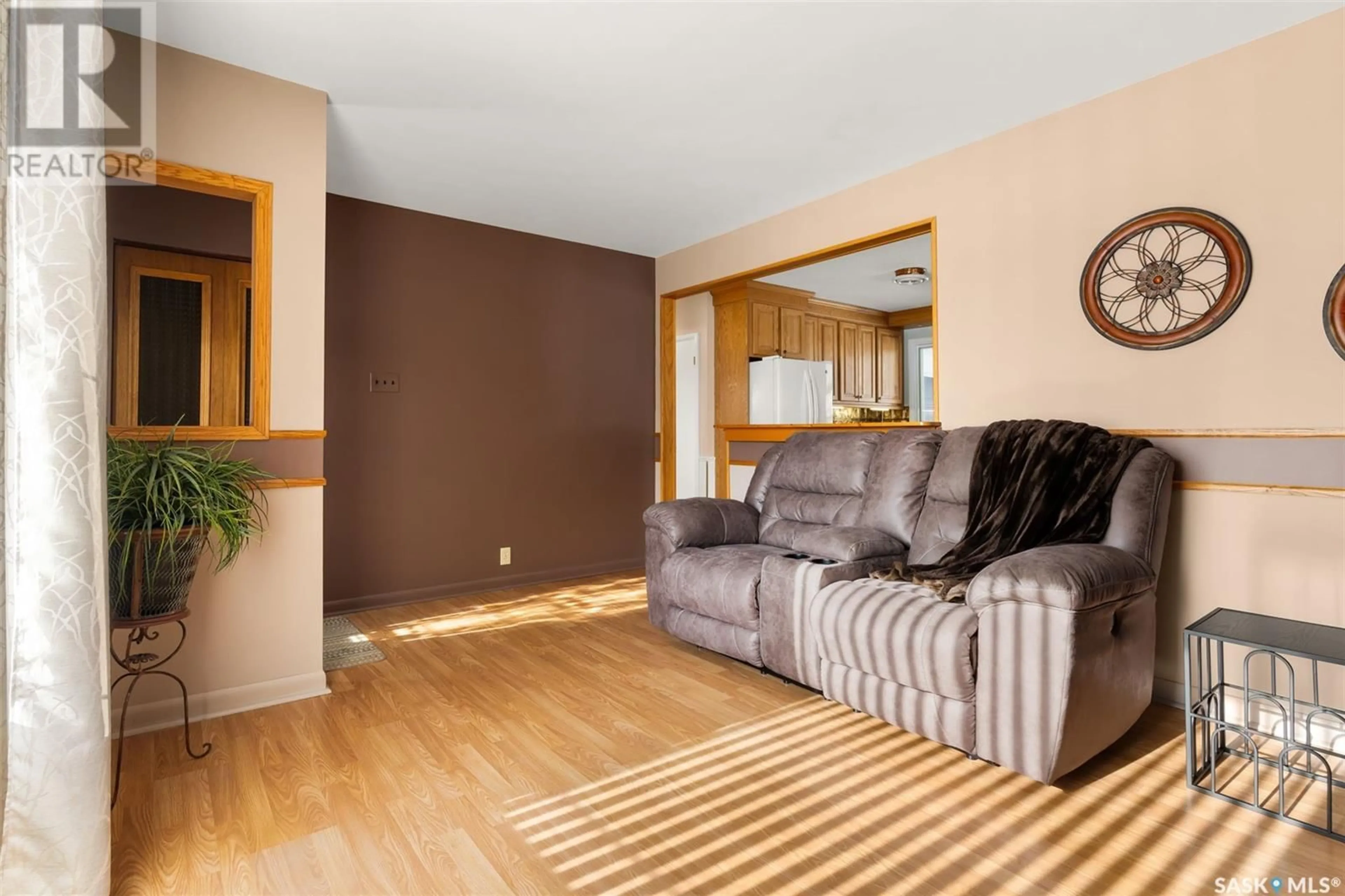 Living room with furniture, wood/laminate floor for 310 Royal STREET, Regina Saskatchewan S4R4Y1