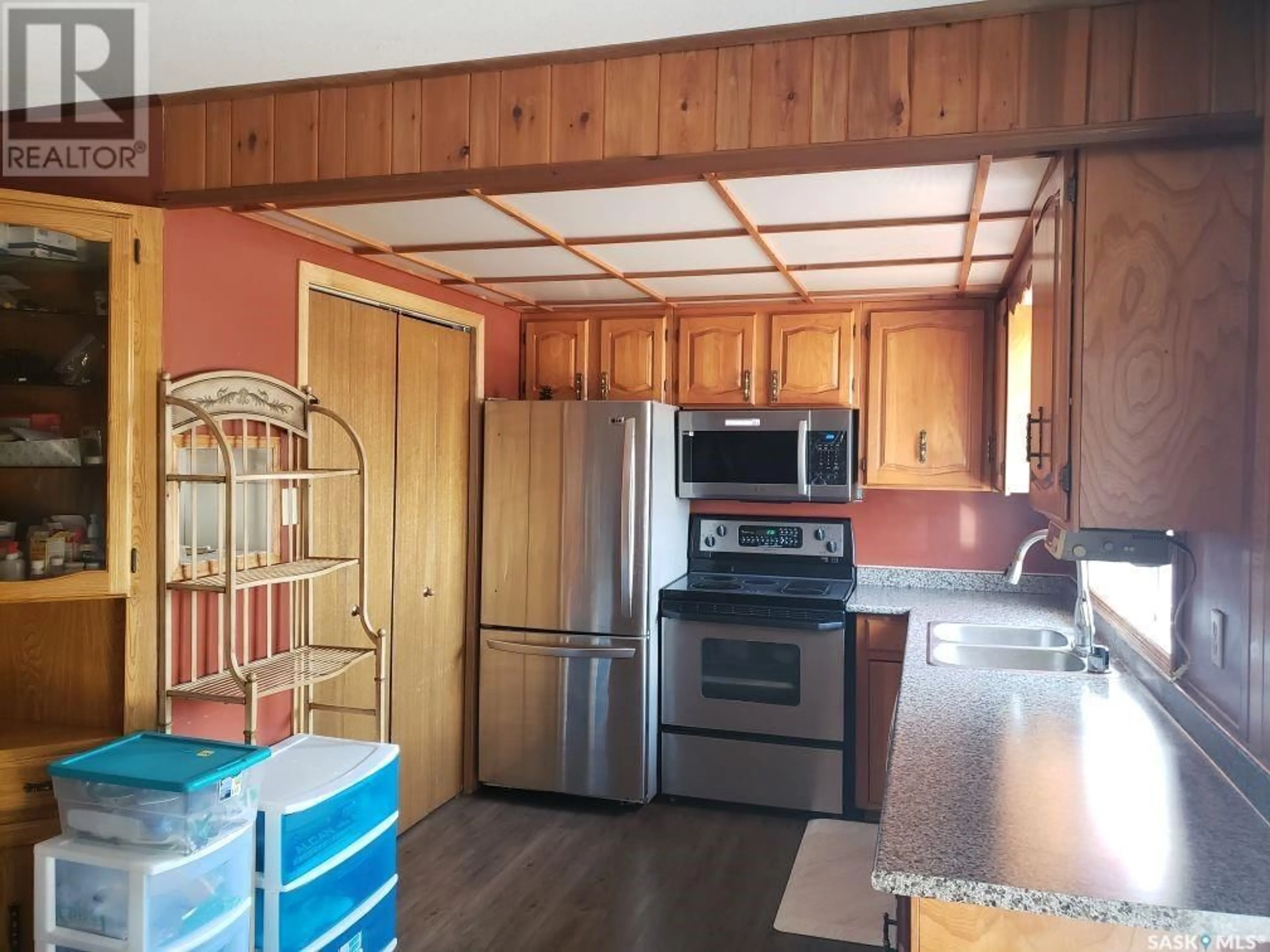 Open concept kitchen, wood/laminate floor for Bautista Acreage, Asquith Saskatchewan S0K0J0