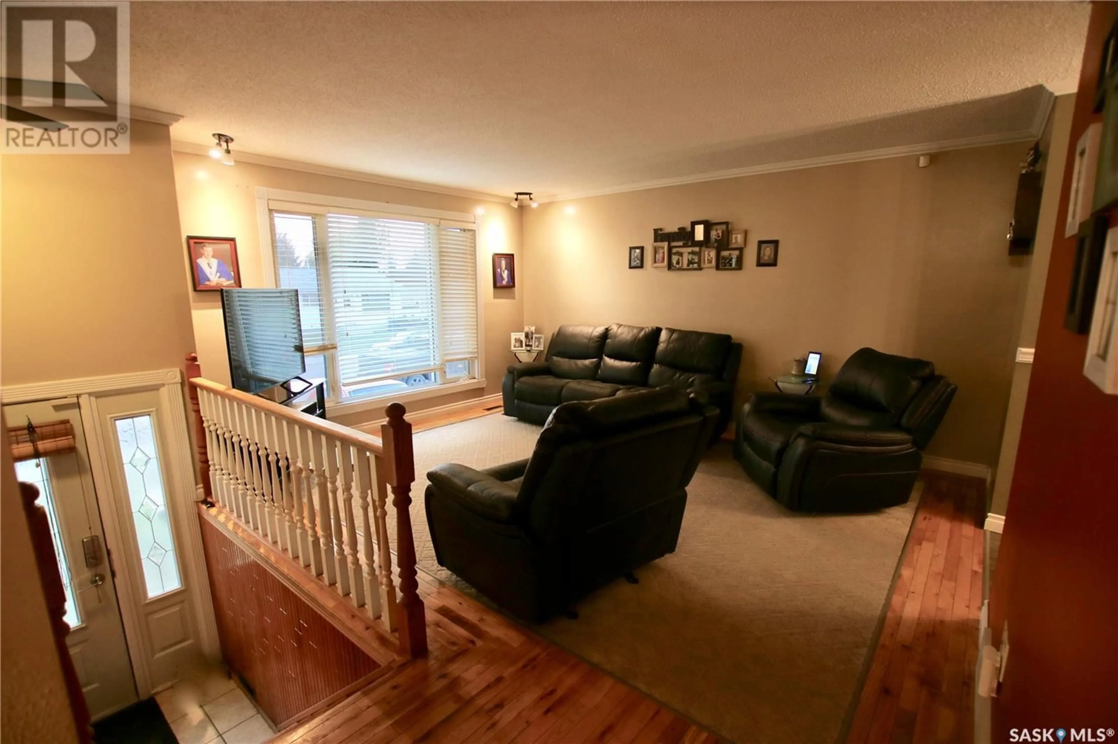 Living room with furniture, wood/laminate floor for 150 MACDOWALL CRESCENT, Prince Albert Saskatchewan S6V6N3