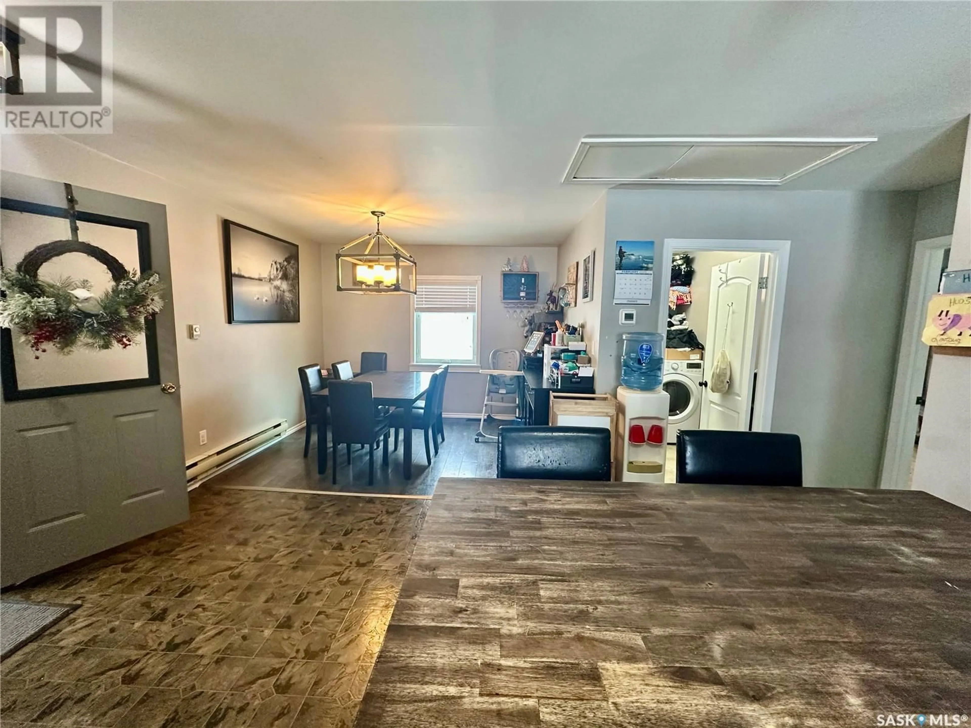 Dining room, wood/laminate floor for Wearing Road Acreage, North Battleford Rm No. 437 Saskatchewan S9A2X3