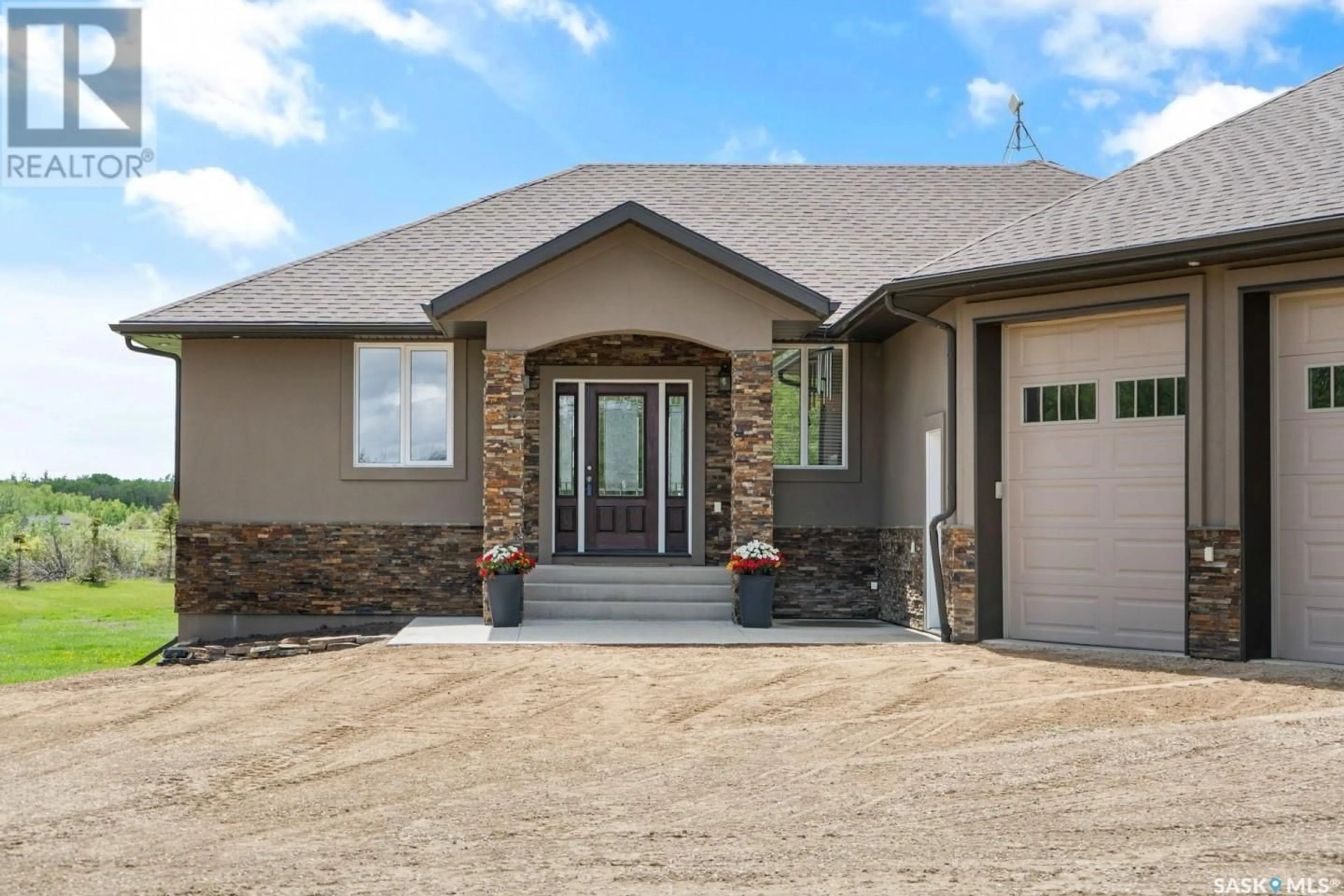 Home with brick exterior material, street for 115 Mission Ridge ROAD, Aberdeen Rm No. 373 Saskatchewan S7J0A5