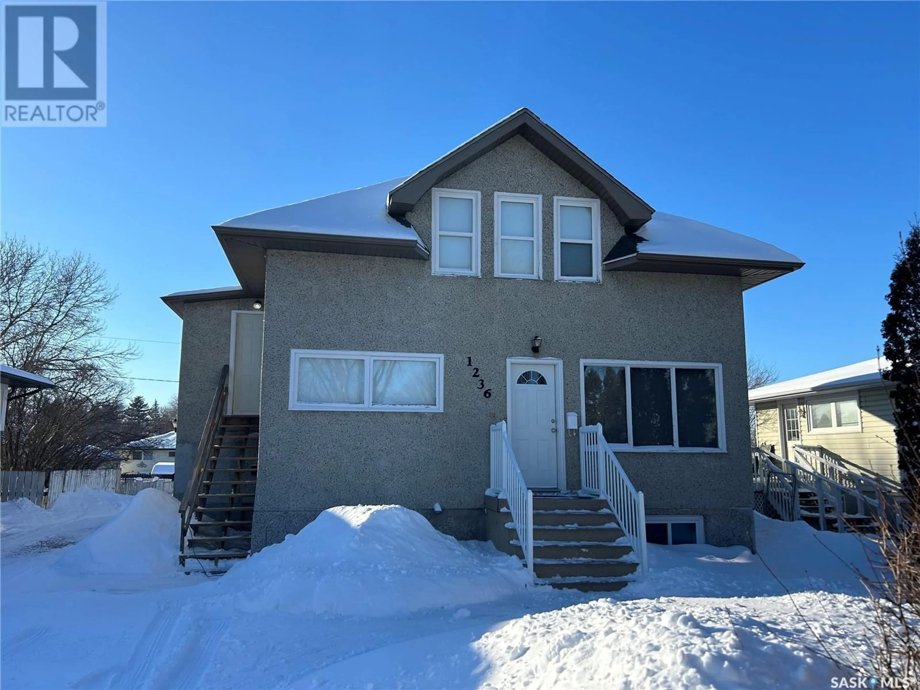 Home with vinyl exterior material, street for 1236 Henleaze AVENUE, Moose Jaw Saskatchewan S6H3V9