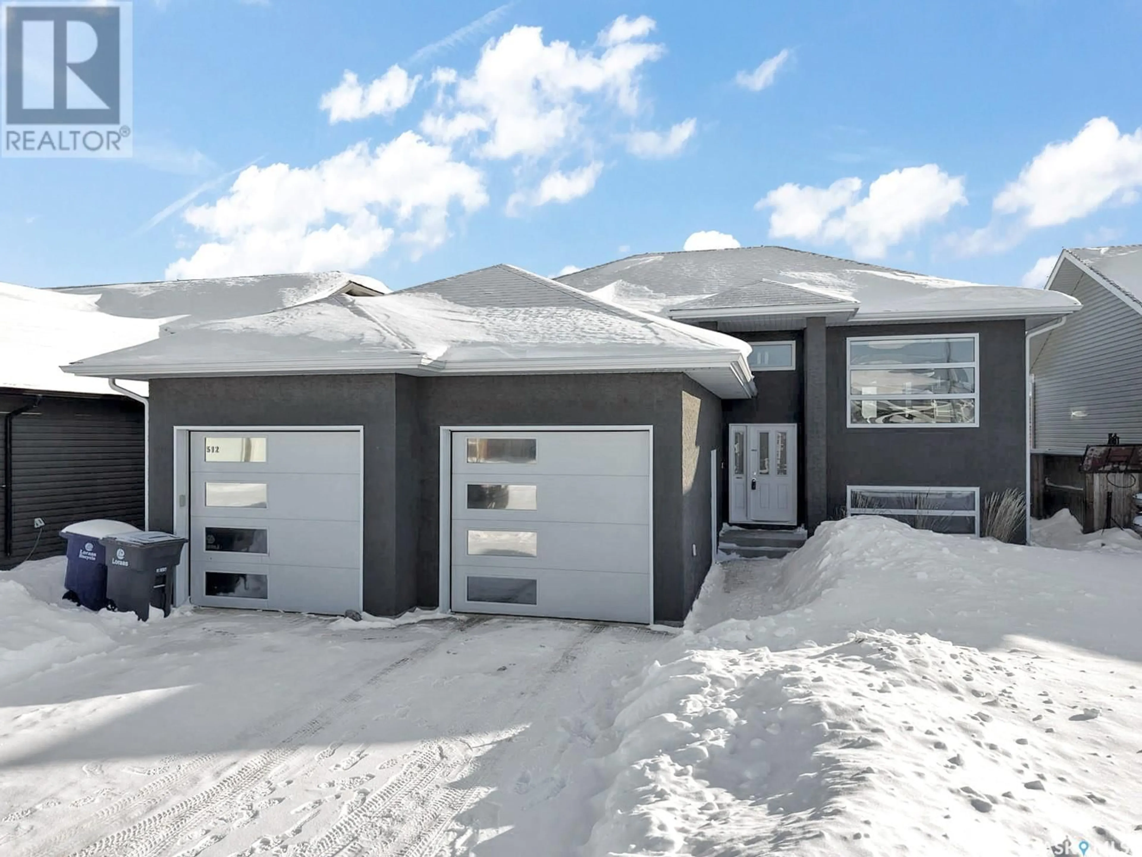 Home with vinyl exterior material, street for 512 Snead LANE, Warman Saskatchewan S0K4S1