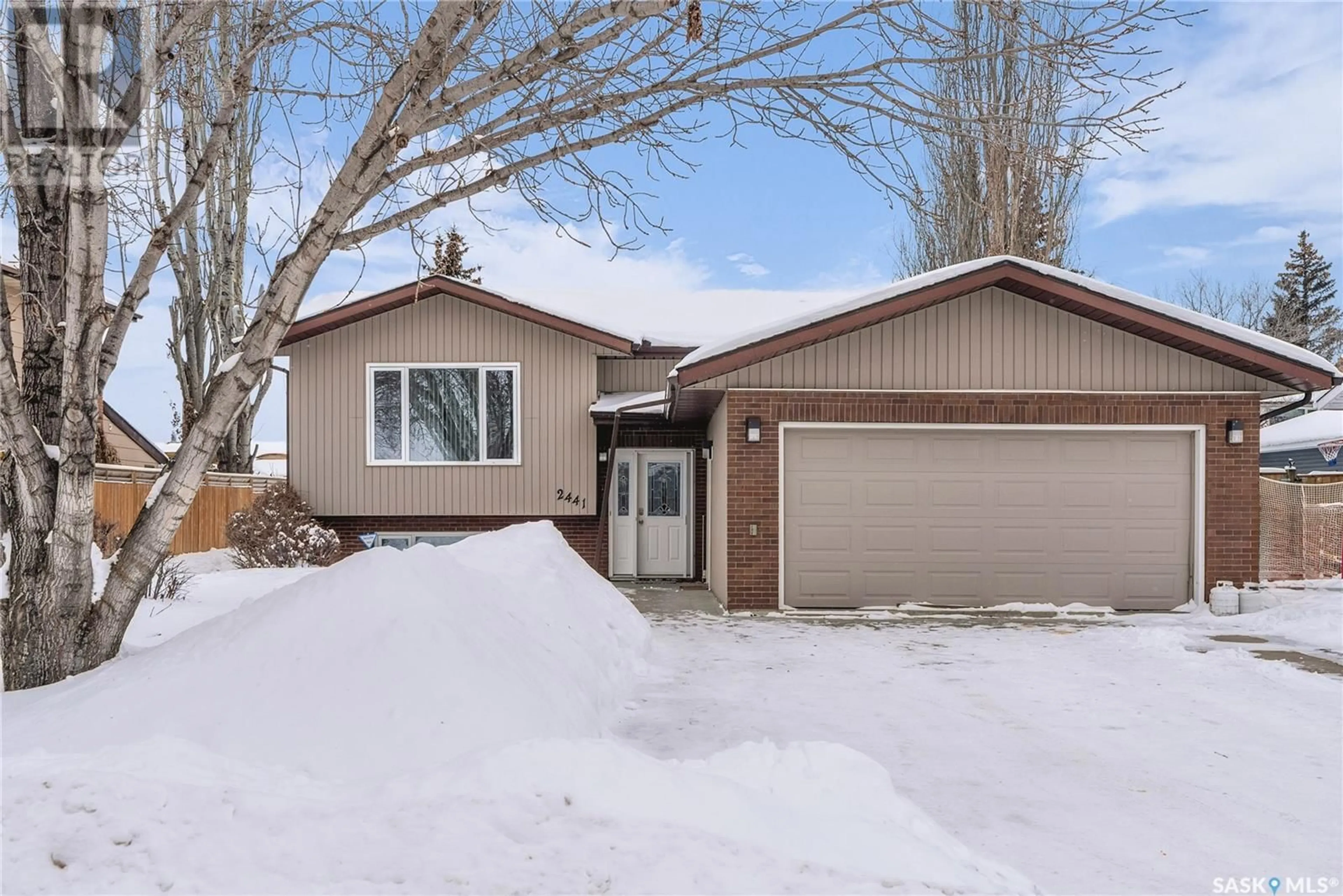 Home with vinyl exterior material, street for 2441 Canary STREET, North Battleford Saskatchewan S9A3T8