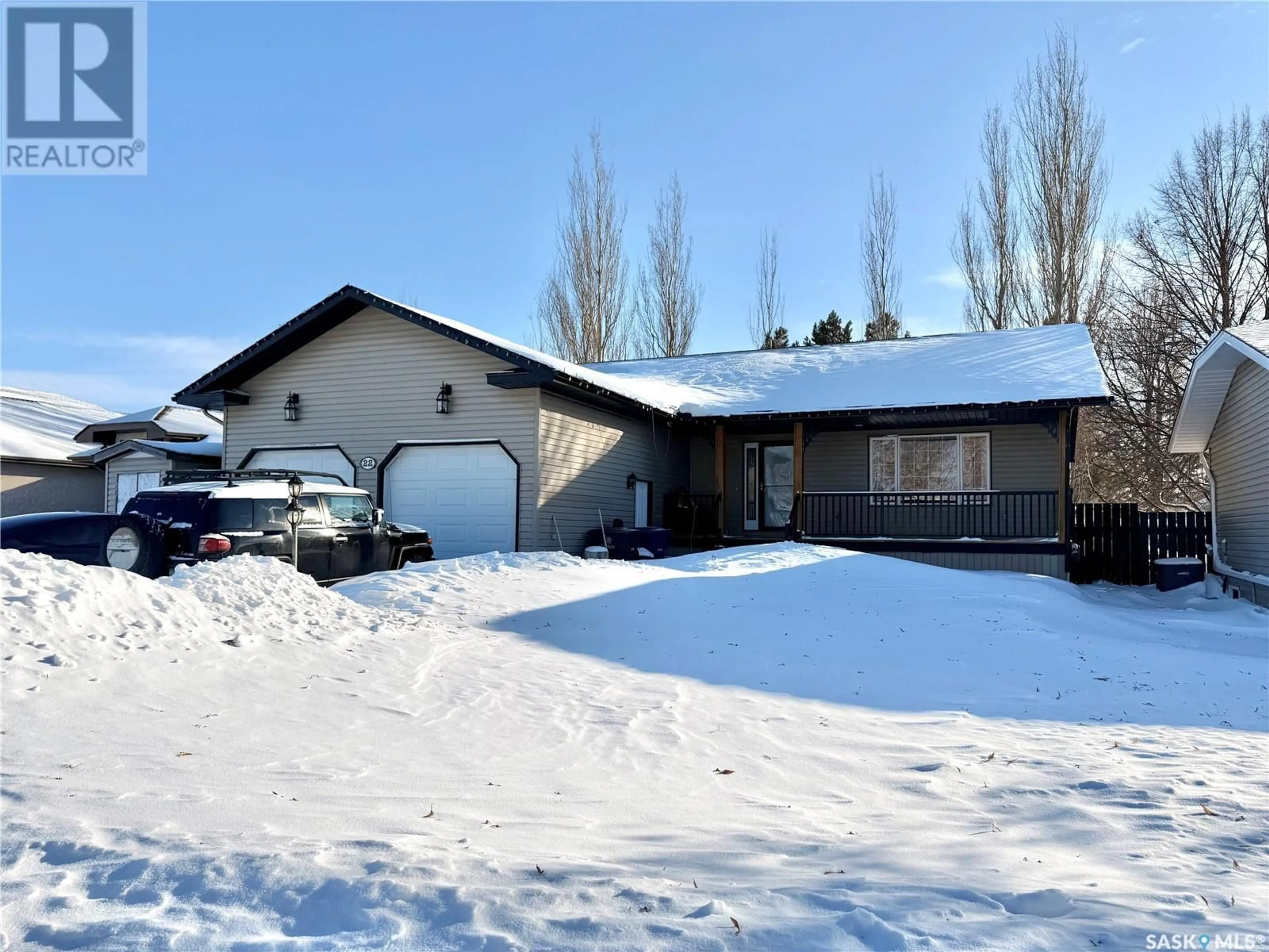 Home with vinyl exterior material, street for 22 REID CRESCENT, Outlook Saskatchewan S0L2N0