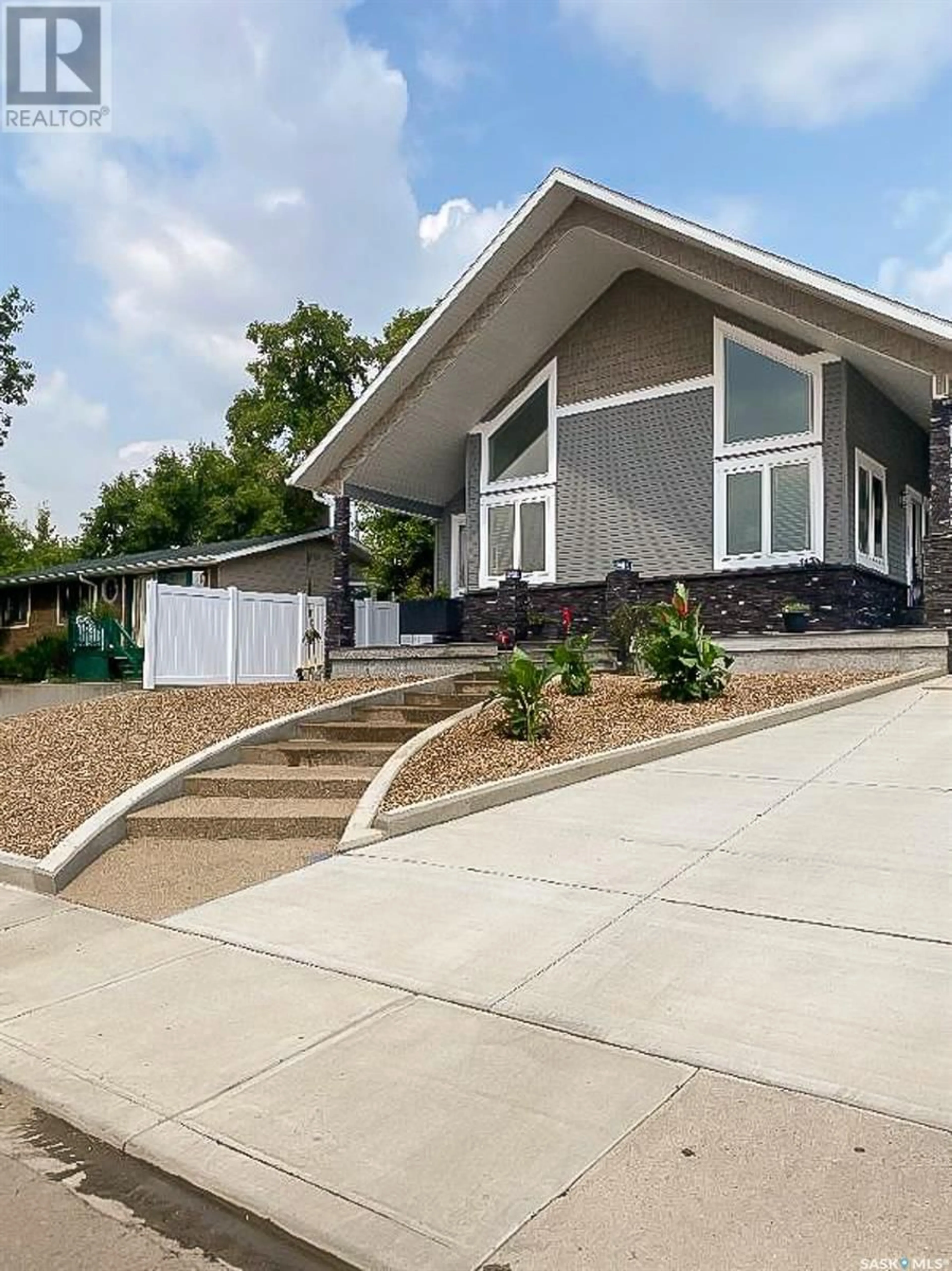 Home with vinyl exterior material, street for 1130 STADACONA STREET, Moose Jaw Saskatchewan S6H2B3