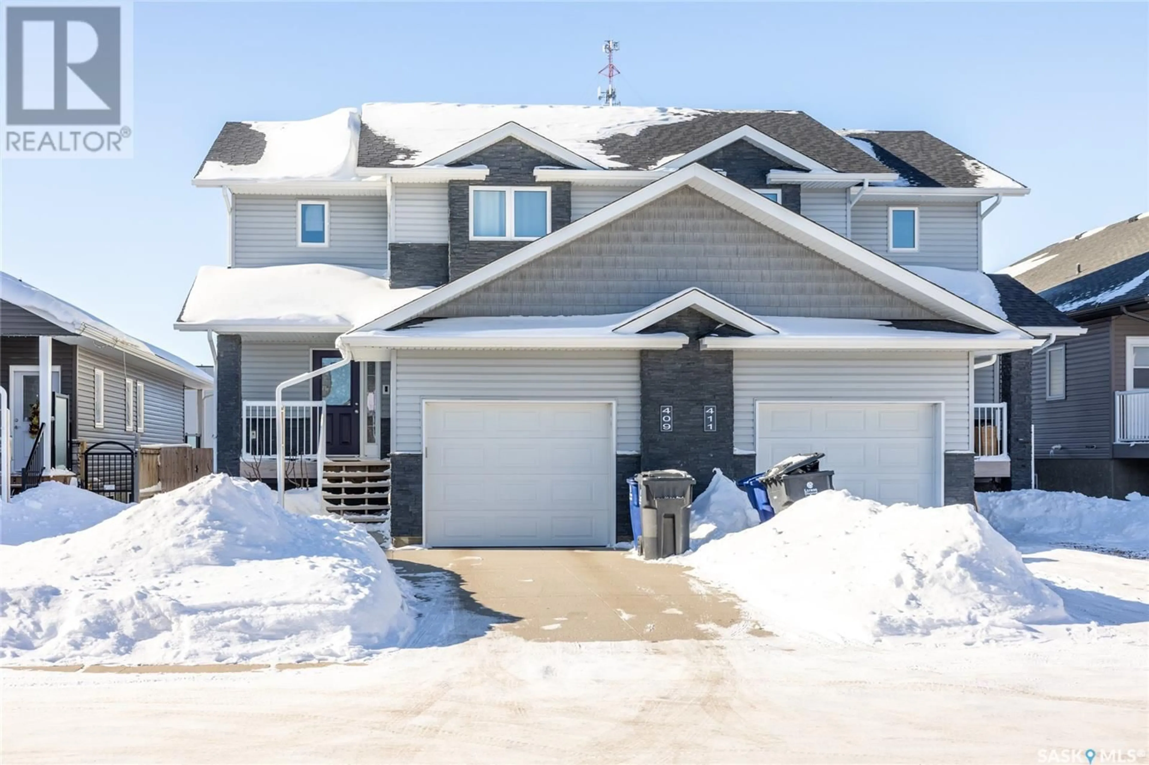 A pic from outside/outdoor area/front of a property/back of a property/a pic from drone, street for 409 Langer PLACE, Warman Saskatchewan S0K4S1