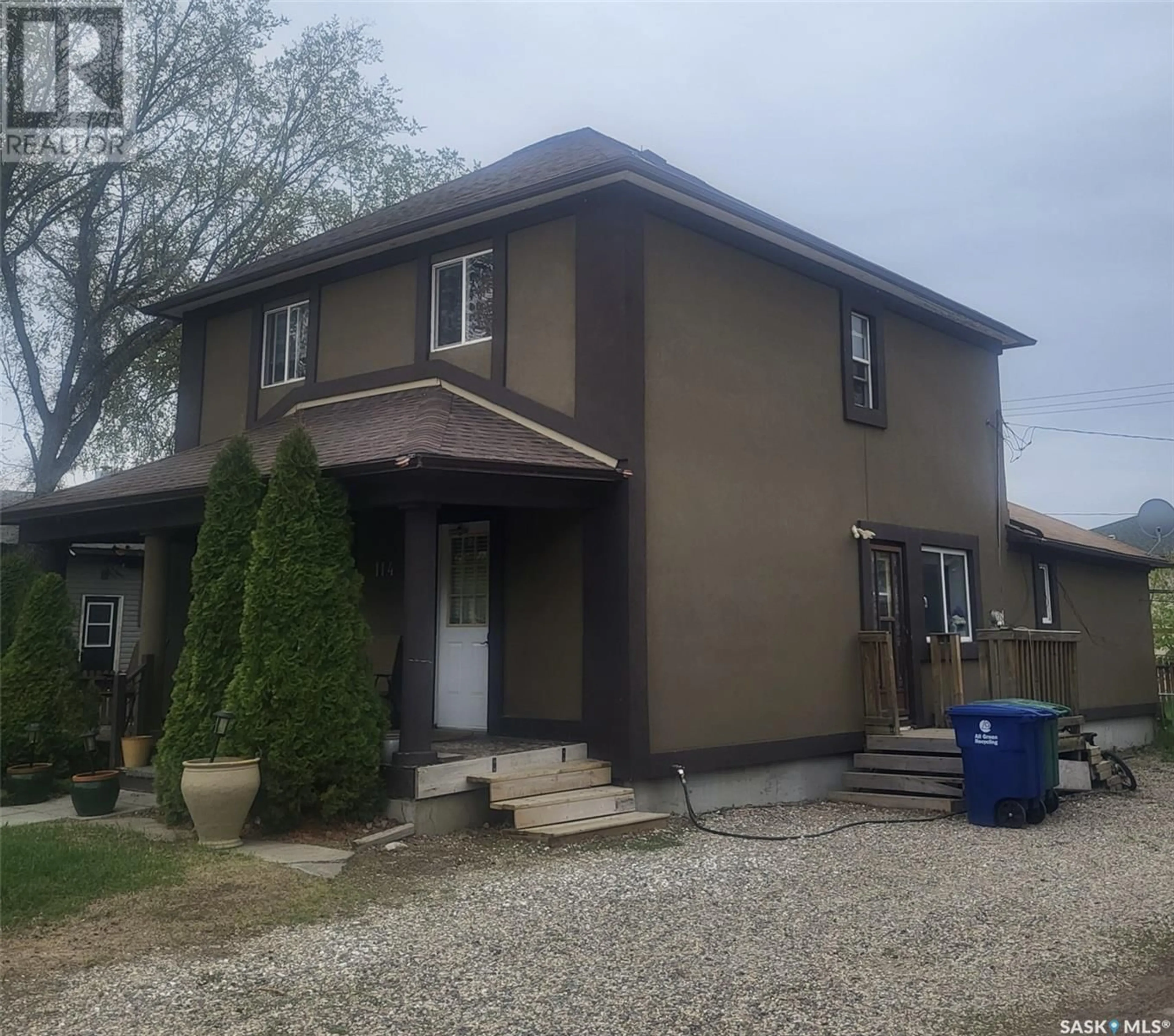 Home with vinyl exterior material, street for 114 2ND AVENUE, Biggar Saskatchewan S0K0M0