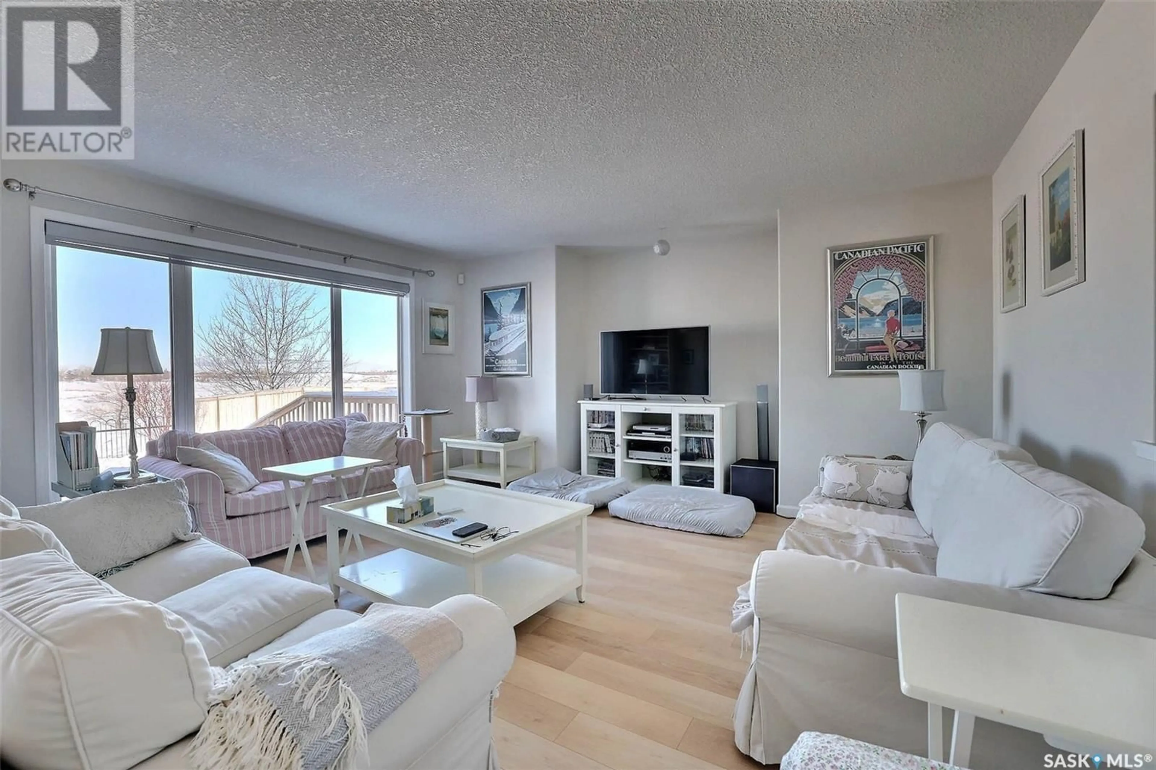 Living room with furniture, unknown for 10494 Wascana ESTATES, Regina Saskatchewan S4V2X2