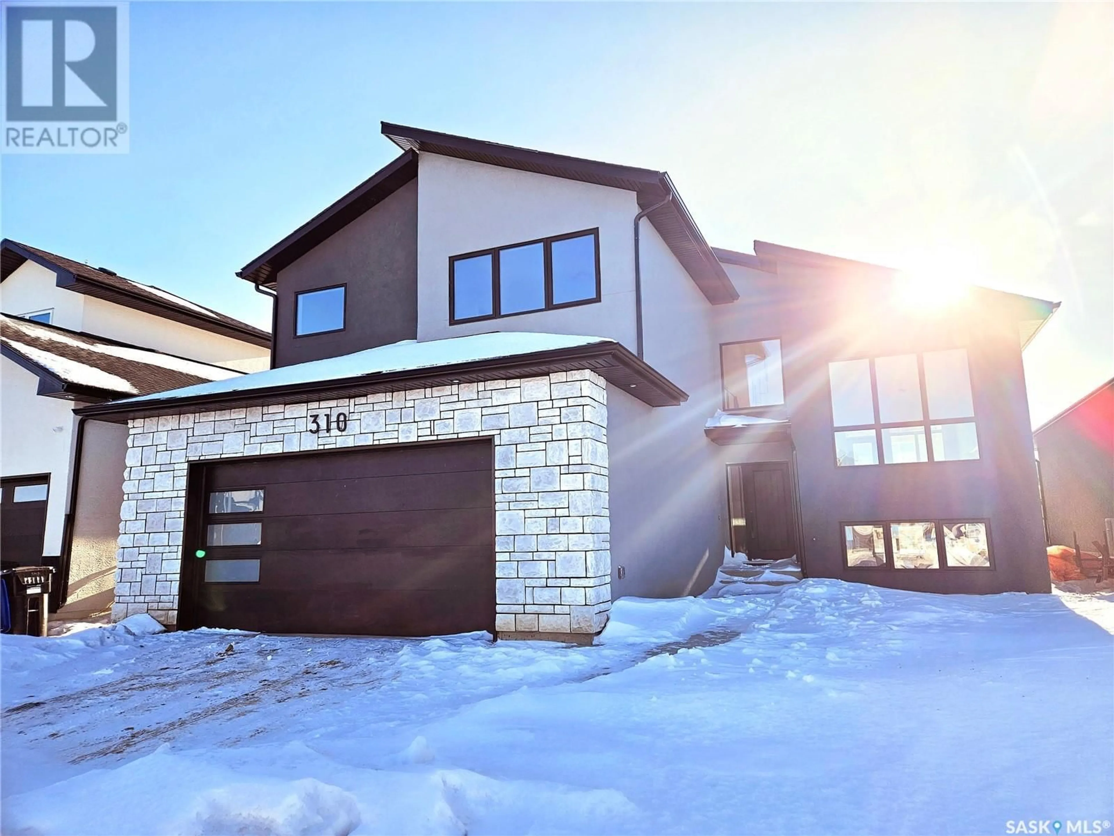 Home with brick exterior material, street for 310 FLYNN MANOR, Saskatoon Saskatchewan S7V0Z4