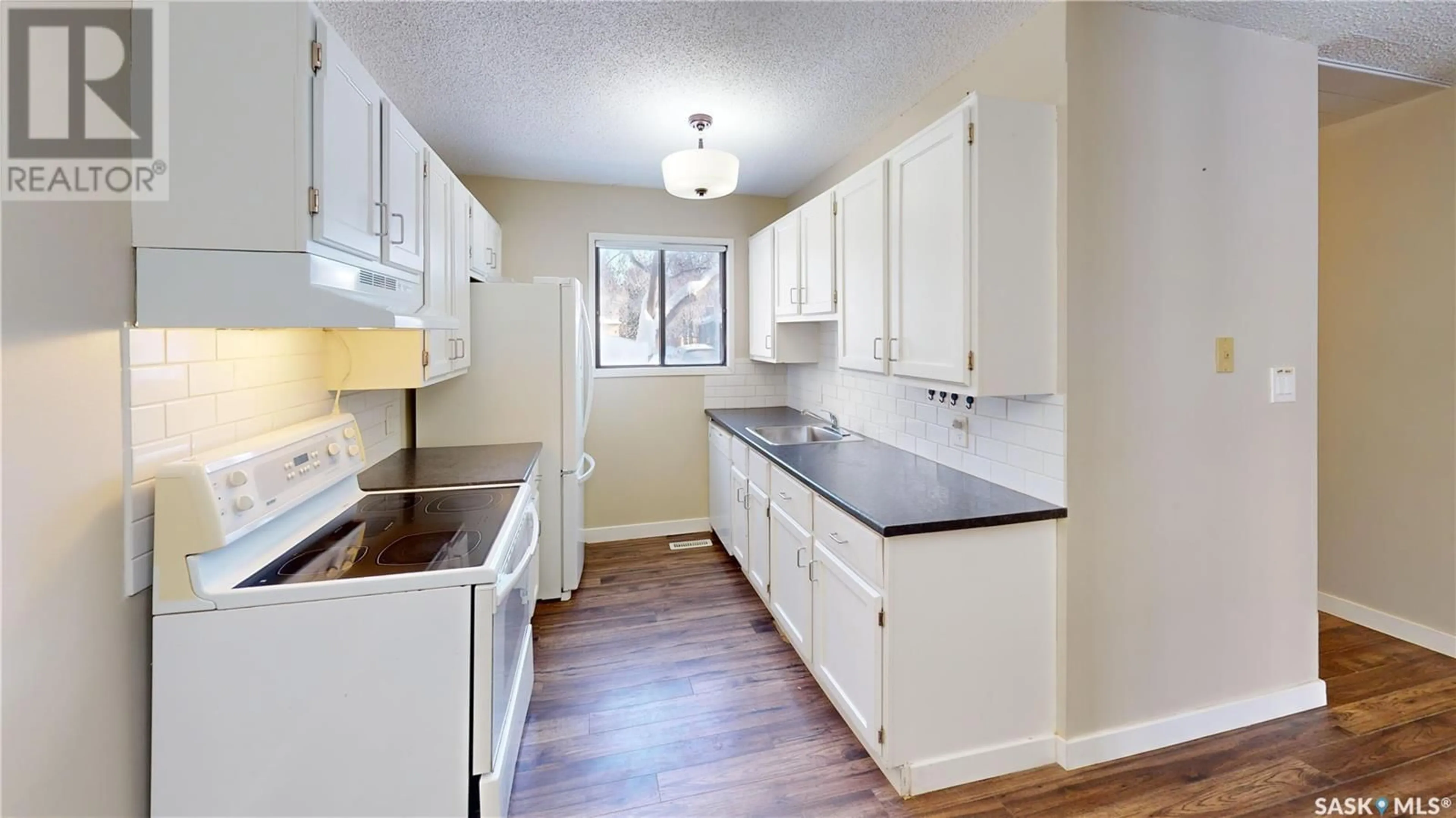 Standard kitchen, wood/laminate floor for 1105 145 Sandy COURT, Saskatoon Saskatchewan S7K6P8