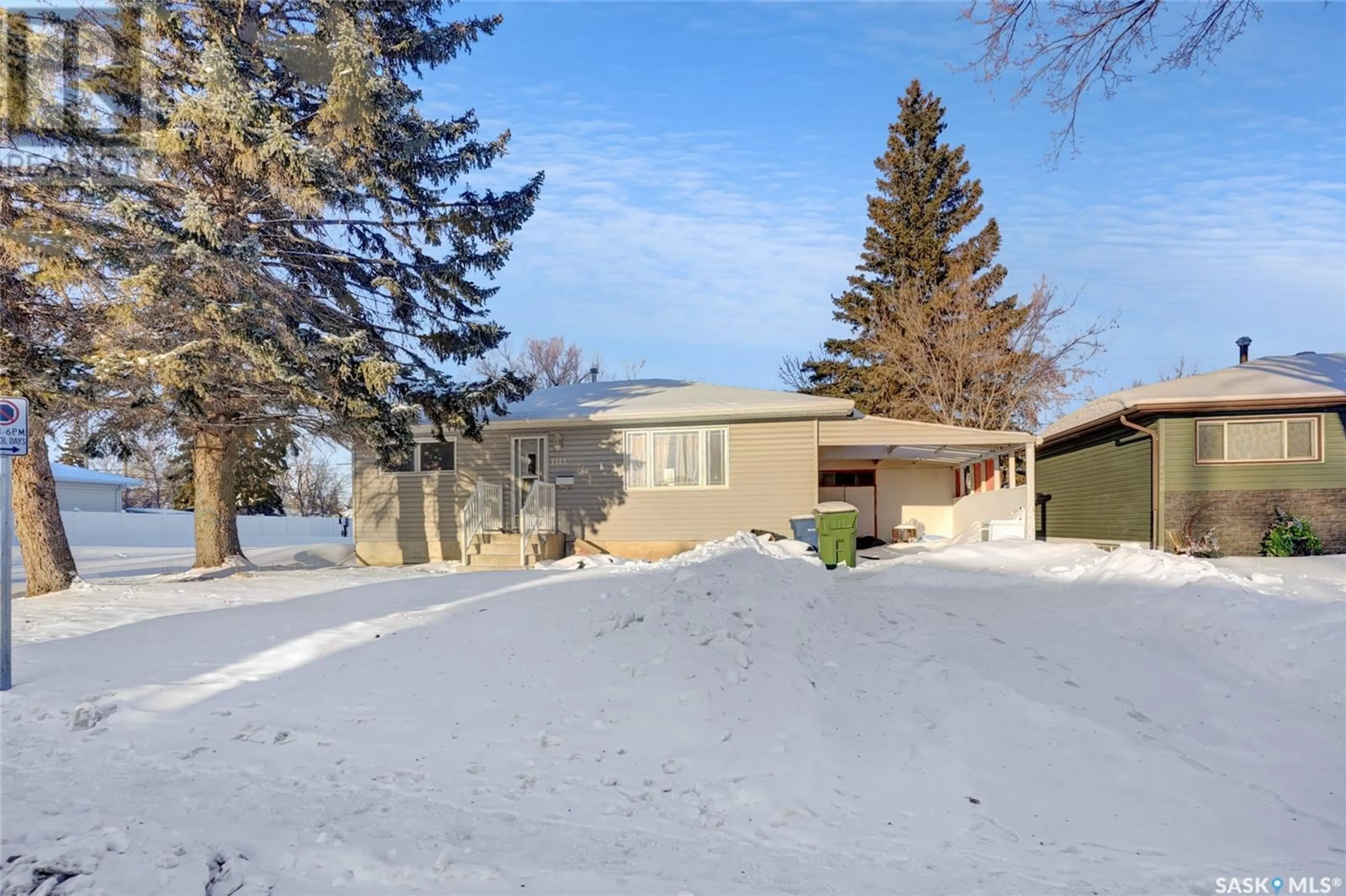 A pic from outside/outdoor area/front of a property/back of a property/a pic from drone, street for 1143 13th AVENUE NW, Moose Jaw Saskatchewan S6H4N5