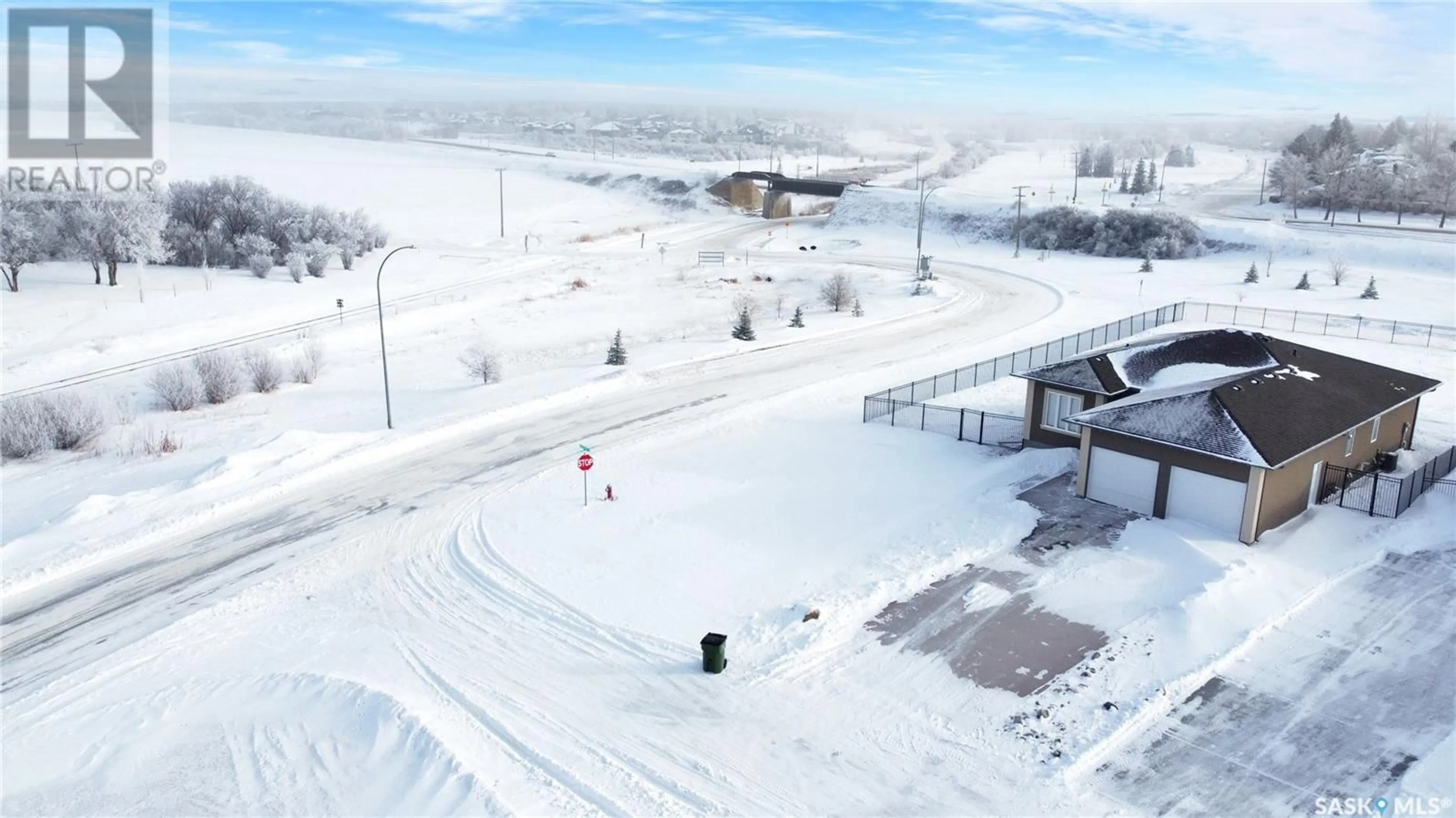 A pic from outside/outdoor area/front of a property/back of a property/a pic from drone, street for 3 Iron Bridge TERRACE, Moose Jaw Saskatchewan S6J0B5