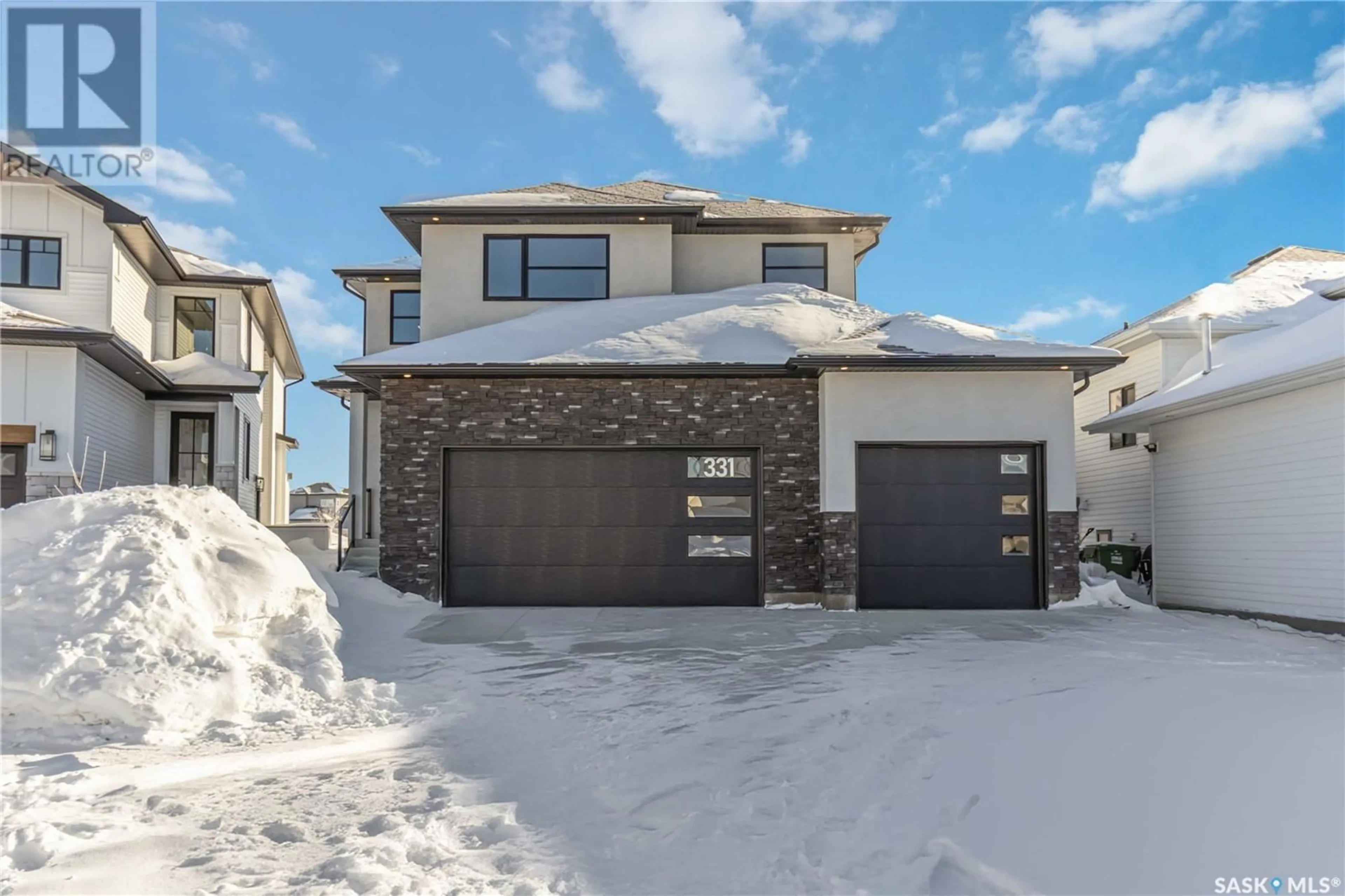 Home with brick exterior material, street for 331 WOOLF BAY, Saskatoon Saskatchewan S7W1E5