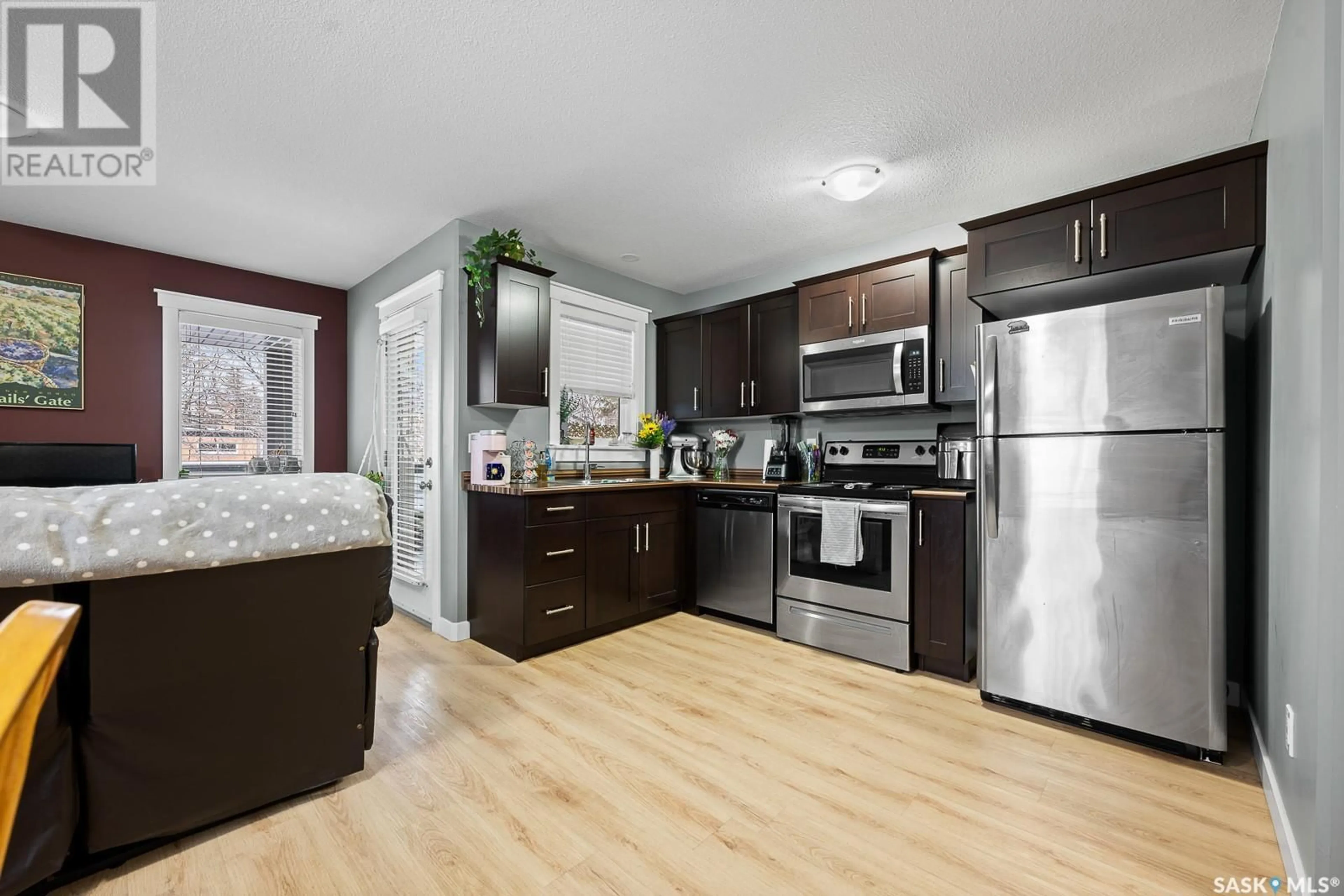 Open concept kitchen, wood/laminate floor for 2650 LACON STREET, Regina Saskatchewan S4N2A6
