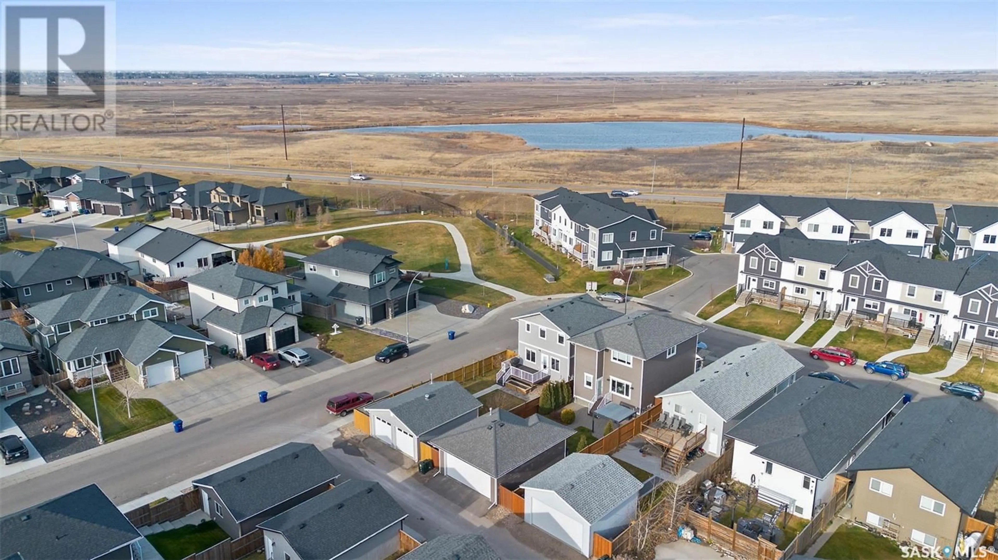 A pic from outside/outdoor area/front of a property/back of a property/a pic from drone, water/lake/river/ocean view for 503 Kloppenburg CRESCENT, Saskatoon Saskatchewan S7W0P1