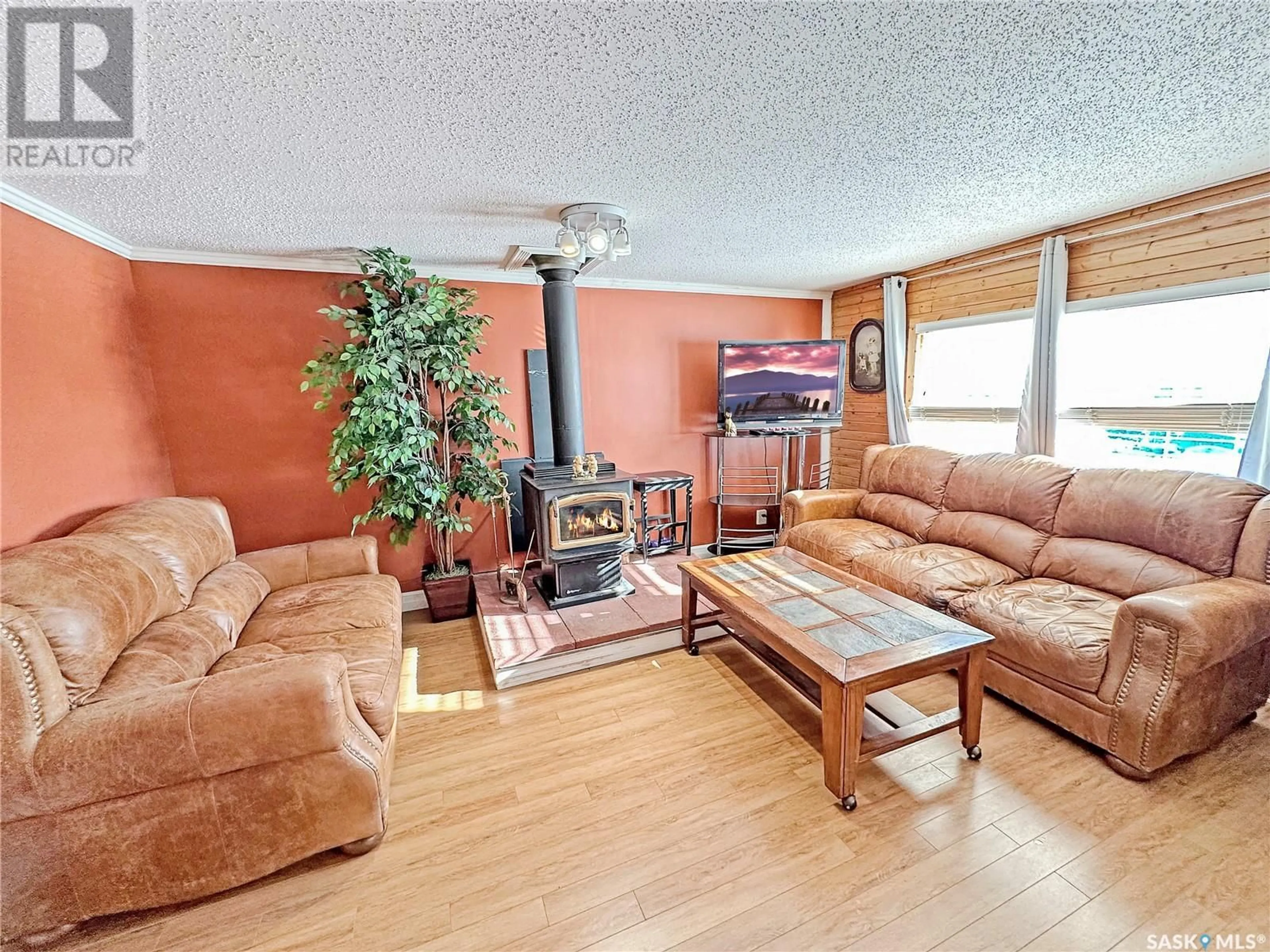 Living room with furniture, wood/laminate floor for 36 Eastview Trailer COURT, Prince Albert Saskatchewan S6V5P9