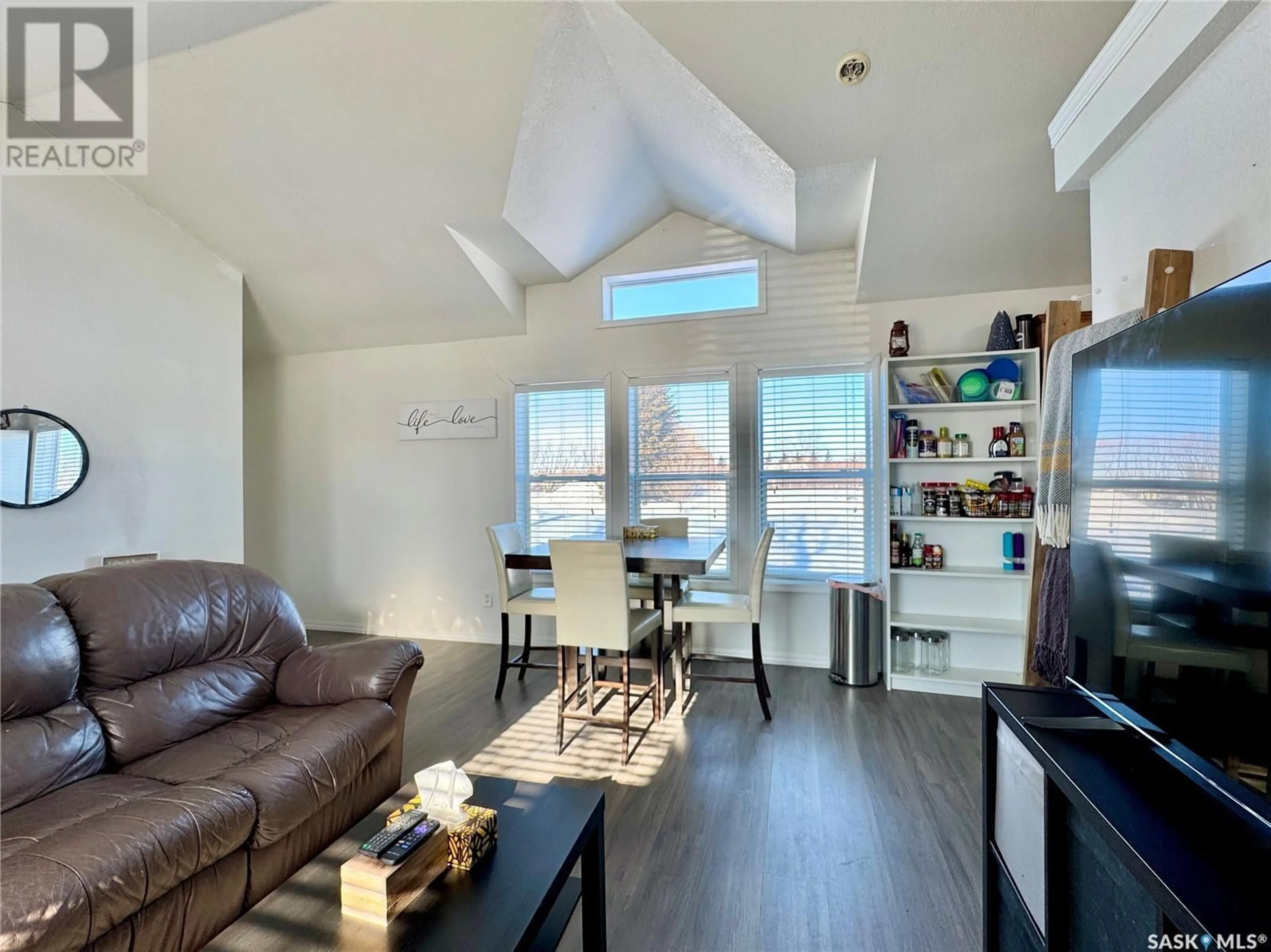 Living room with furniture, wood/laminate floor for 116 Rudy STREET, Churchbridge Saskatchewan S0A0M0