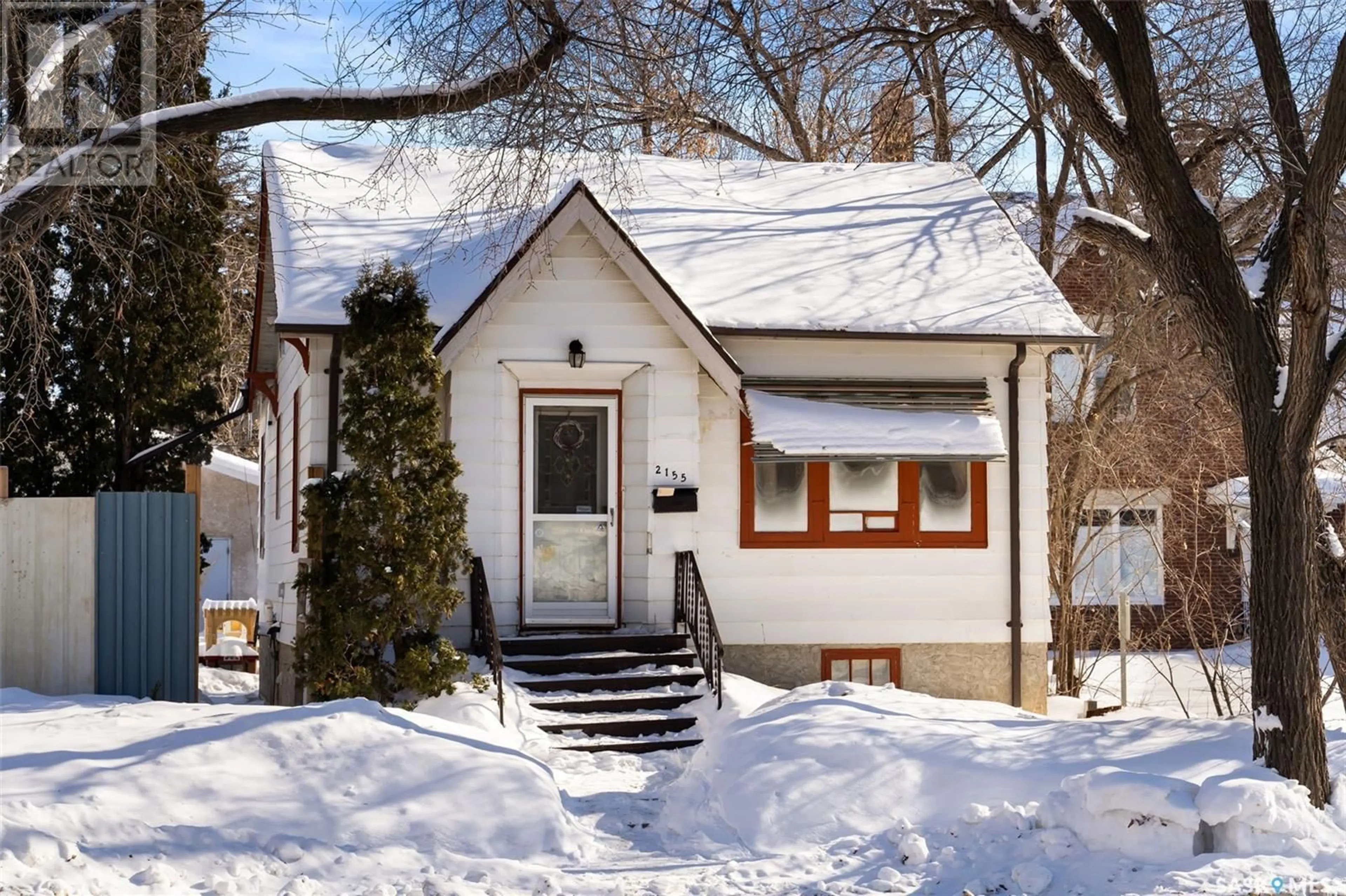 Home with vinyl exterior material, street for 2155 Winnipeg STREET, Regina Saskatchewan S4P1G9