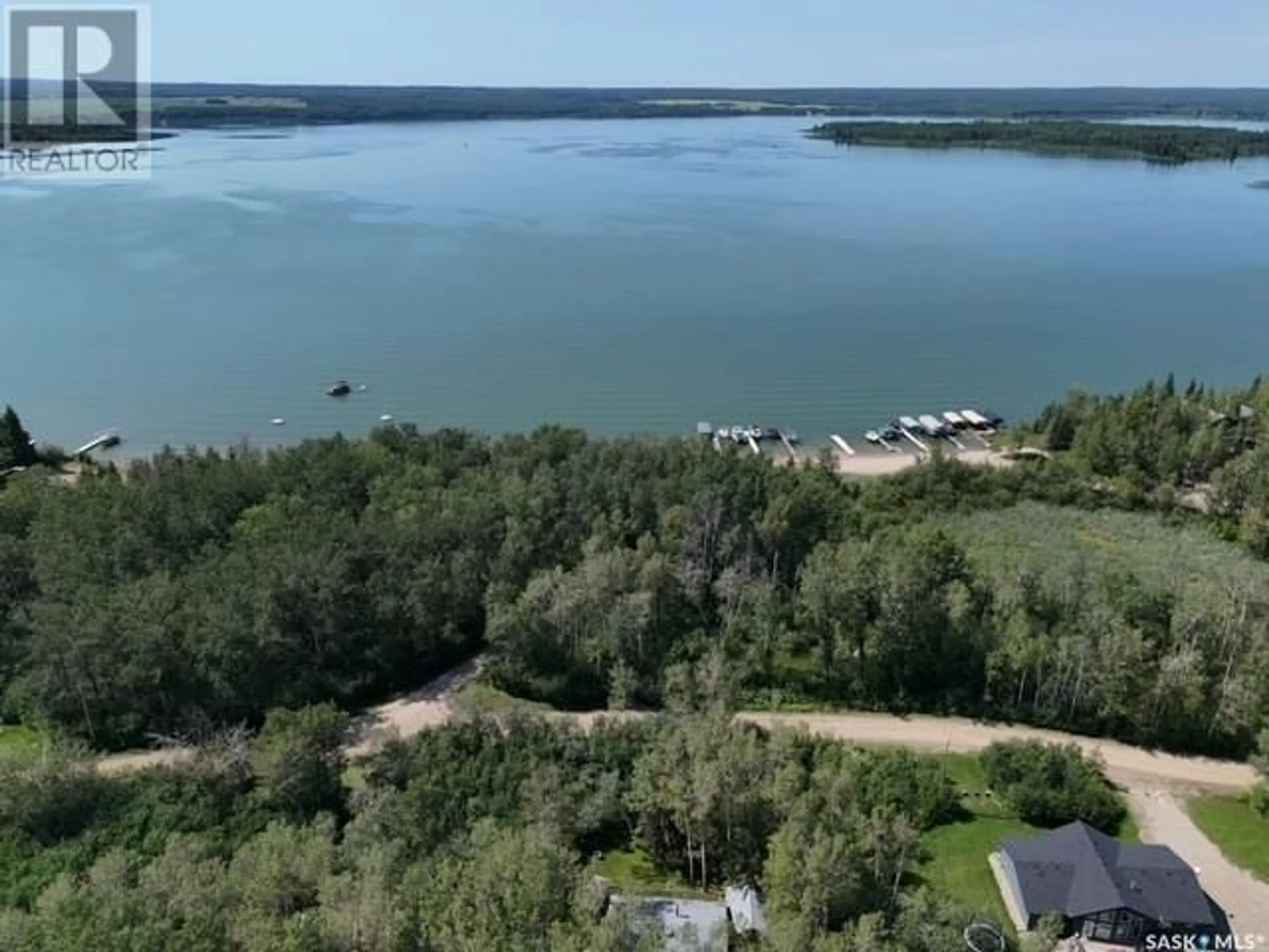 A pic from outside/outdoor area/front of a property/back of a property/a pic from drone, water/lake/river/ocean view for 300 LOON DRIVE, Big Shell Saskatchewan S0J2G0