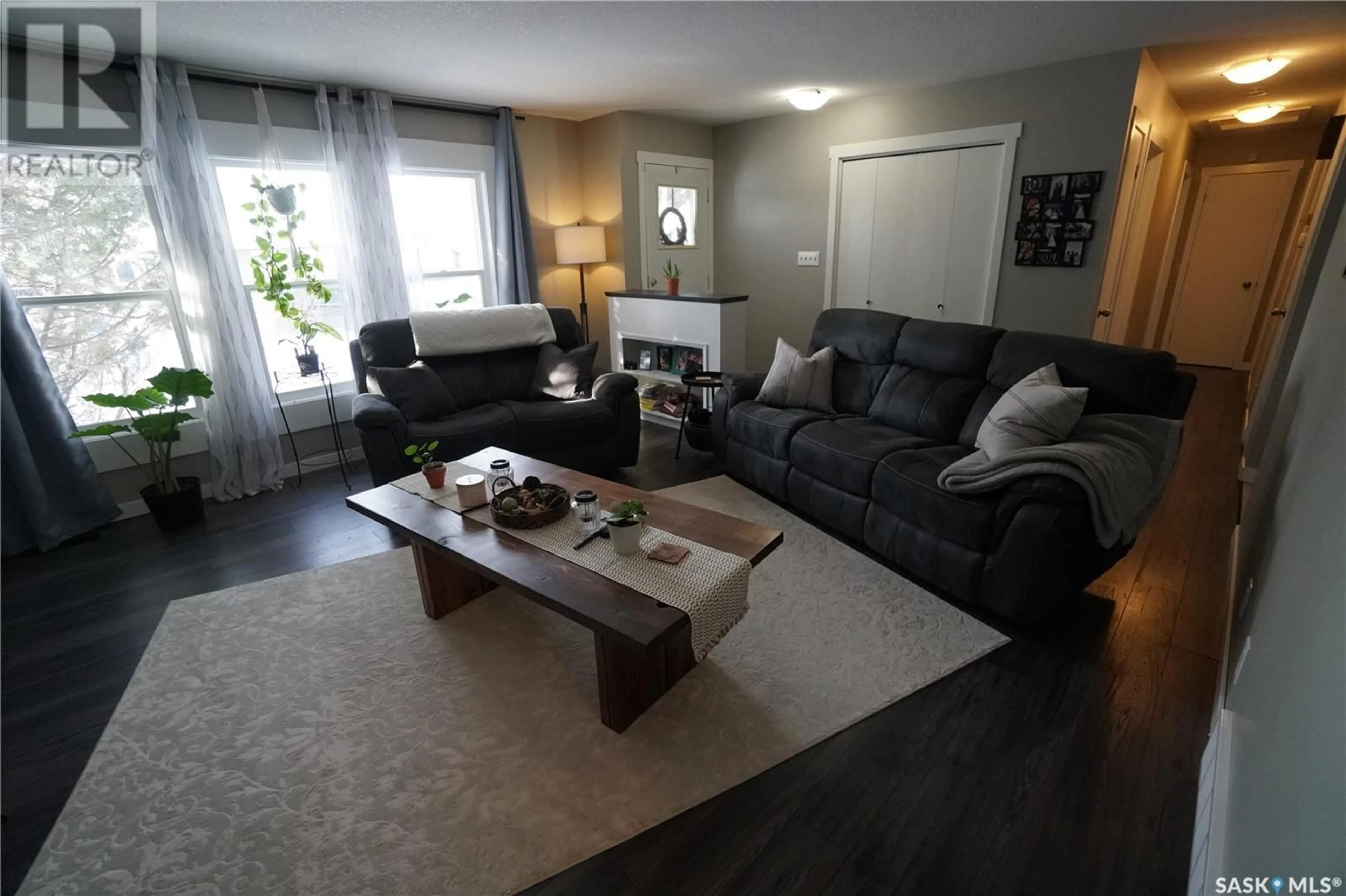 Living room with furniture, wood/laminate floor for 267 Fairview ROAD, Regina Saskatchewan S4R5V1