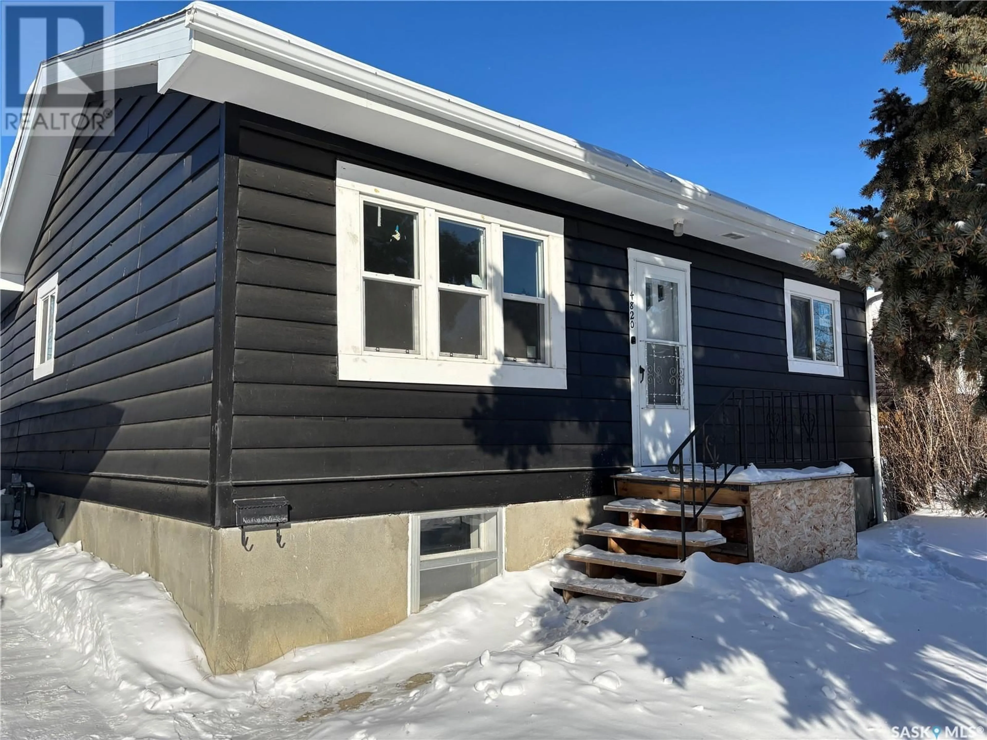 Home with vinyl exterior material, street for 4820 7th AVENUE, Regina Saskatchewan S4T0R7