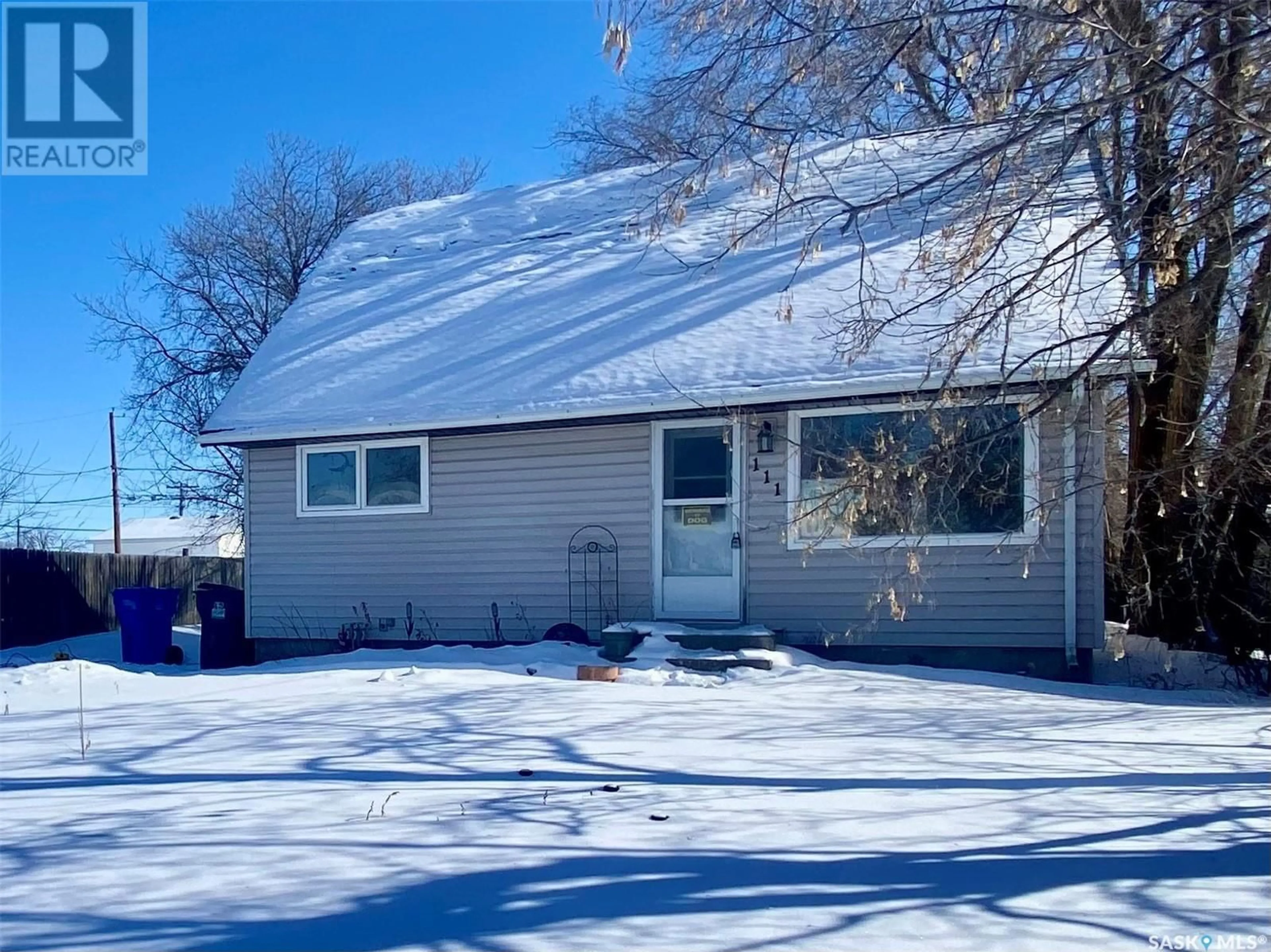 Home with vinyl exterior material, street for 111 2nd STREET W, Carnduff Saskatchewan S0C0S0