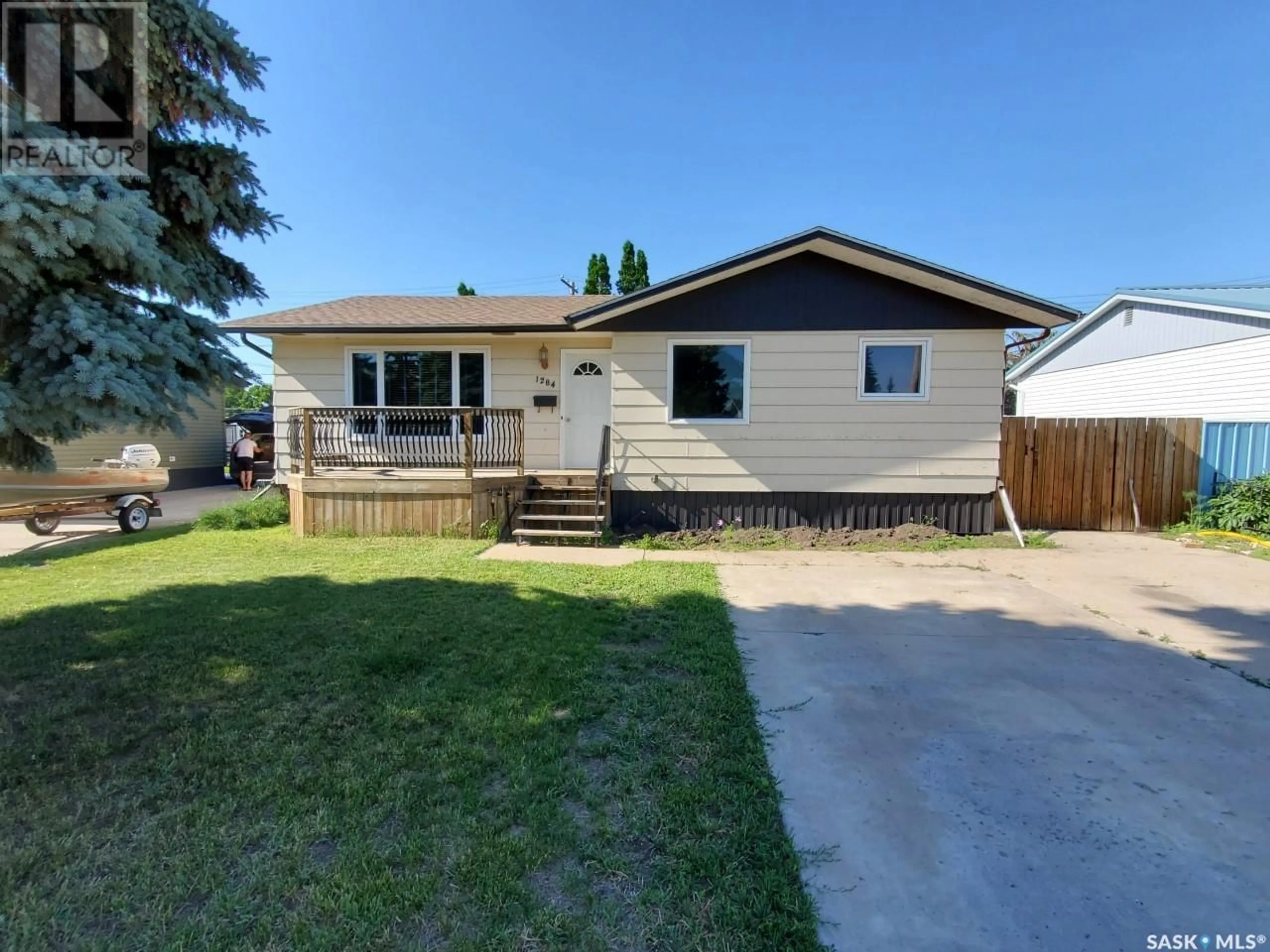 Home with vinyl exterior material, street for 1284 King STREET, Estevan Saskatchewan S4A1L5