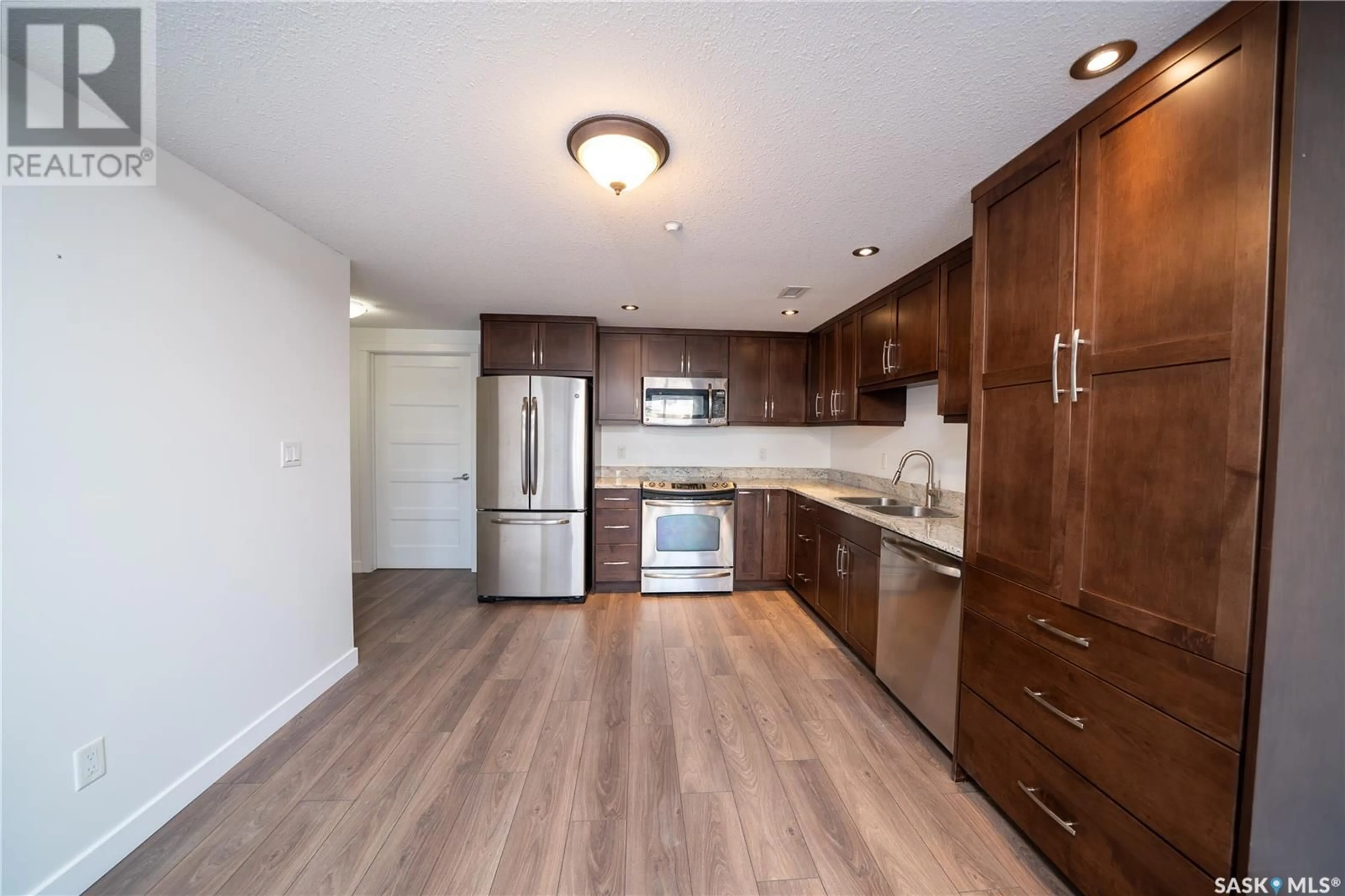 Standard kitchen, wood/laminate floor for 101 2300 Broad STREET, Regina Saskatchewan S4P1Y8