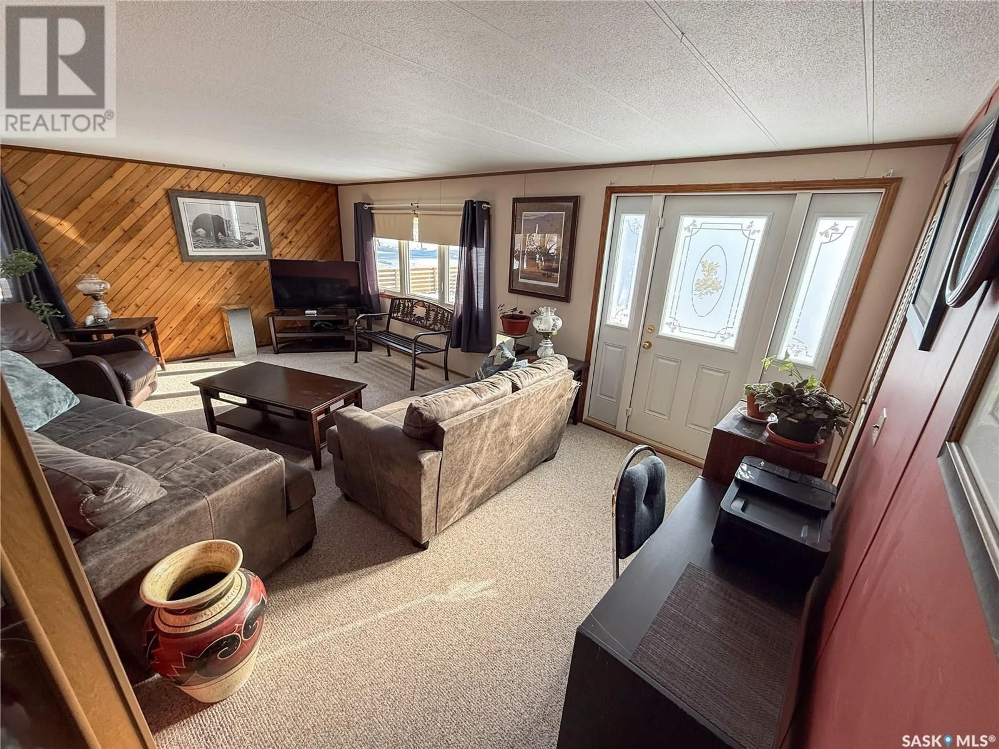 Living room with furniture, unknown for 201 - 203 4TH AVENUE, Climax Saskatchewan S0N0N0
