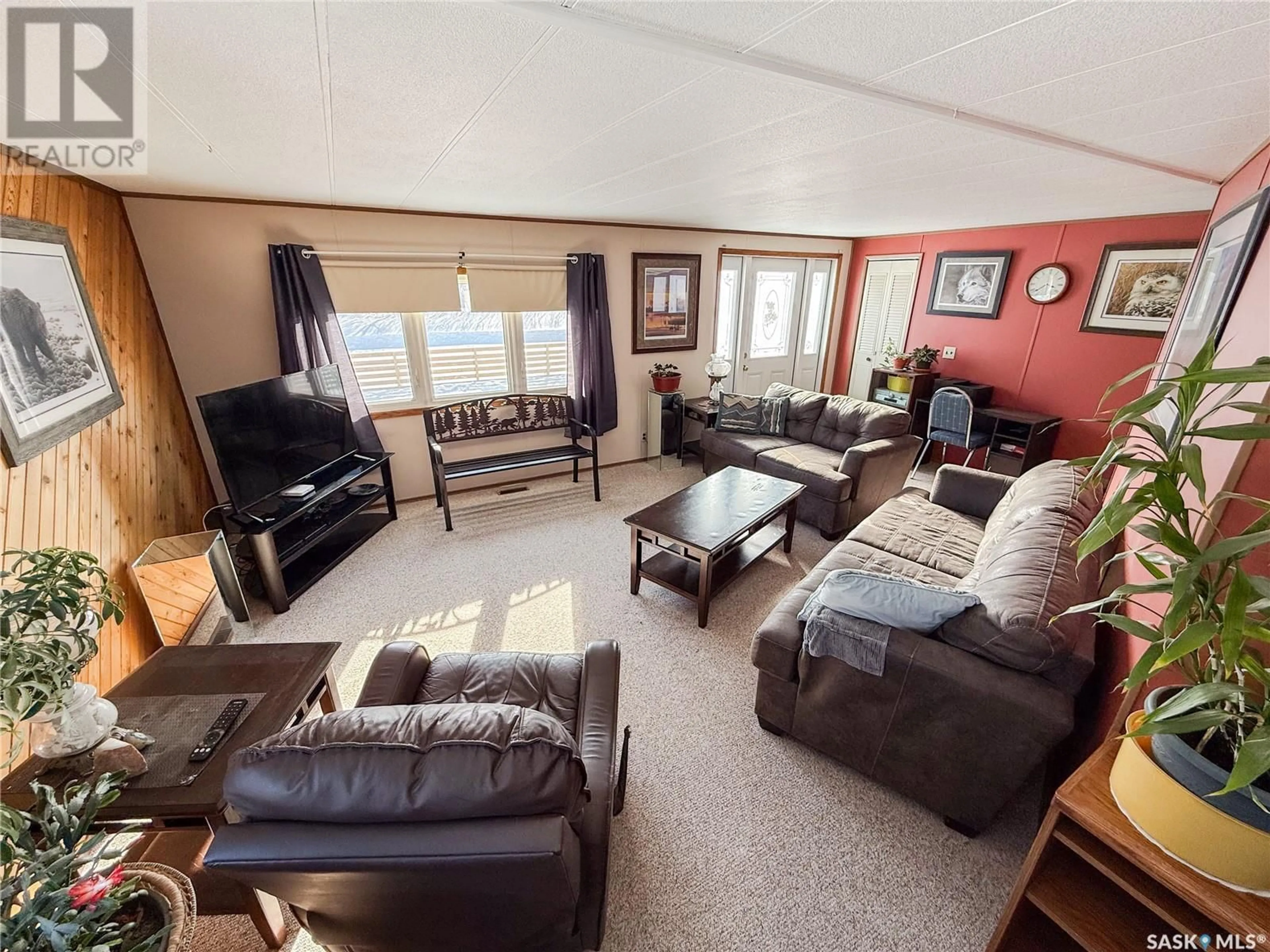 Living room with furniture, unknown for 201 - 203 4TH AVENUE, Climax Saskatchewan S0N0N0