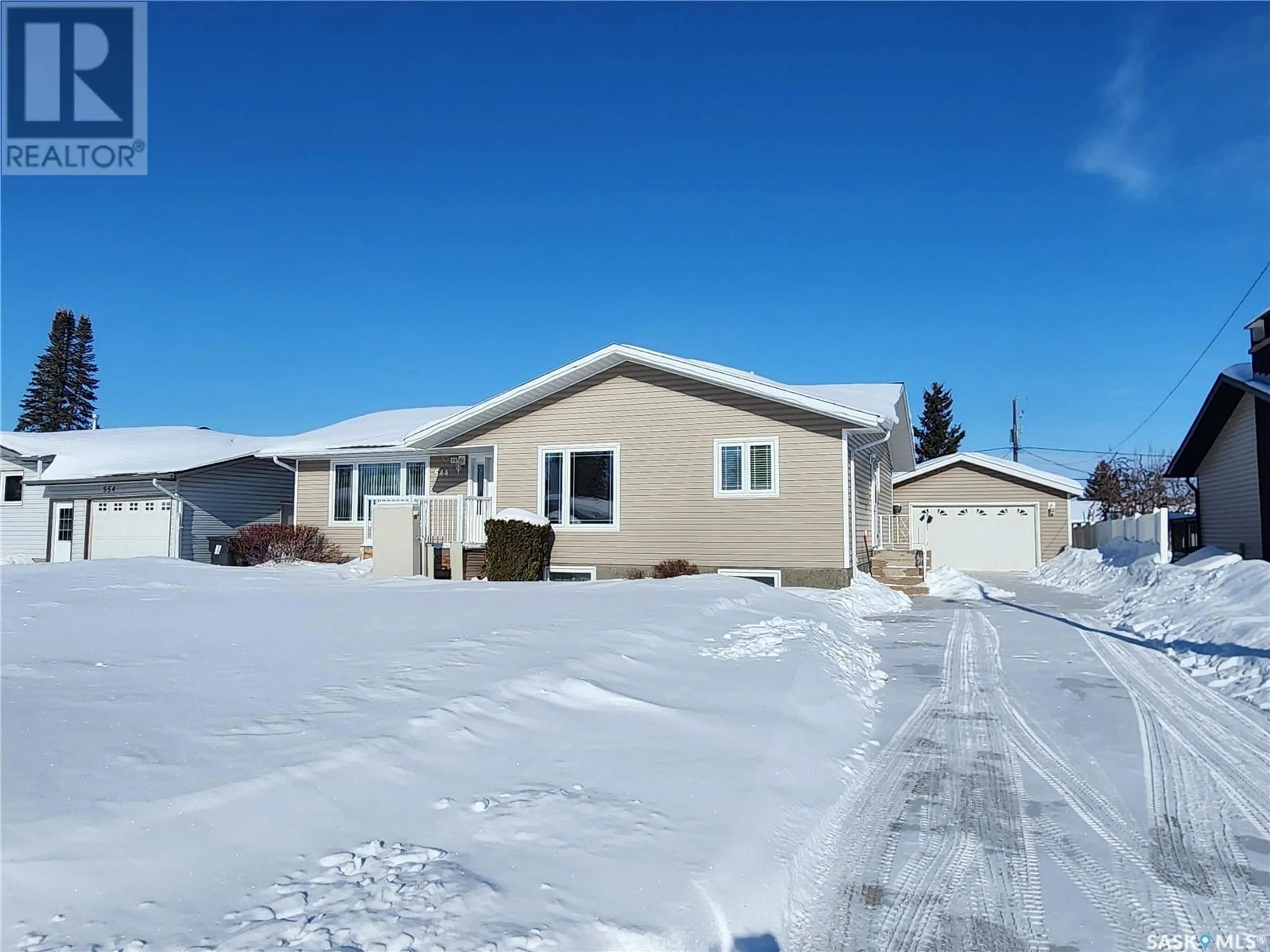 Home with vinyl exterior material, street for 544 9th AVENUE W, Melville Saskatchewan S0A2P0