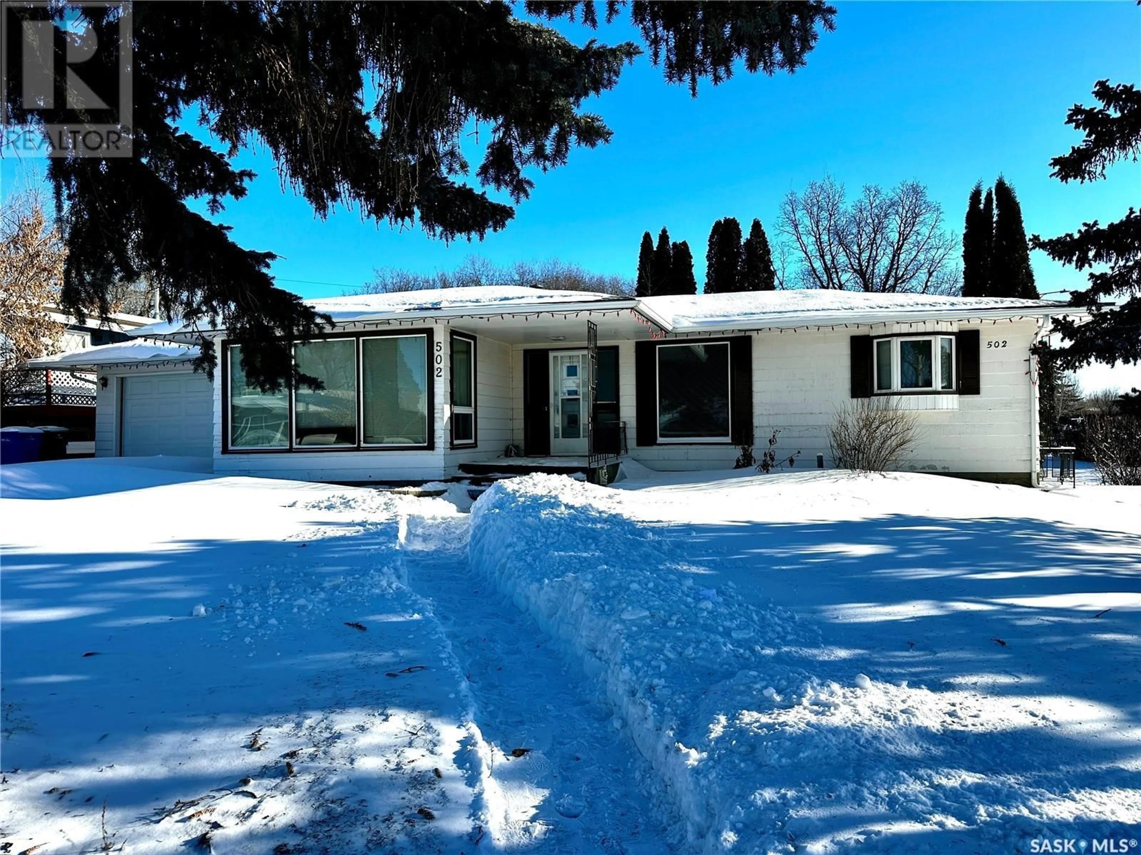 Home with vinyl exterior material, street for 502 100th STREET, North Battleford Saskatchewan S9A0T4