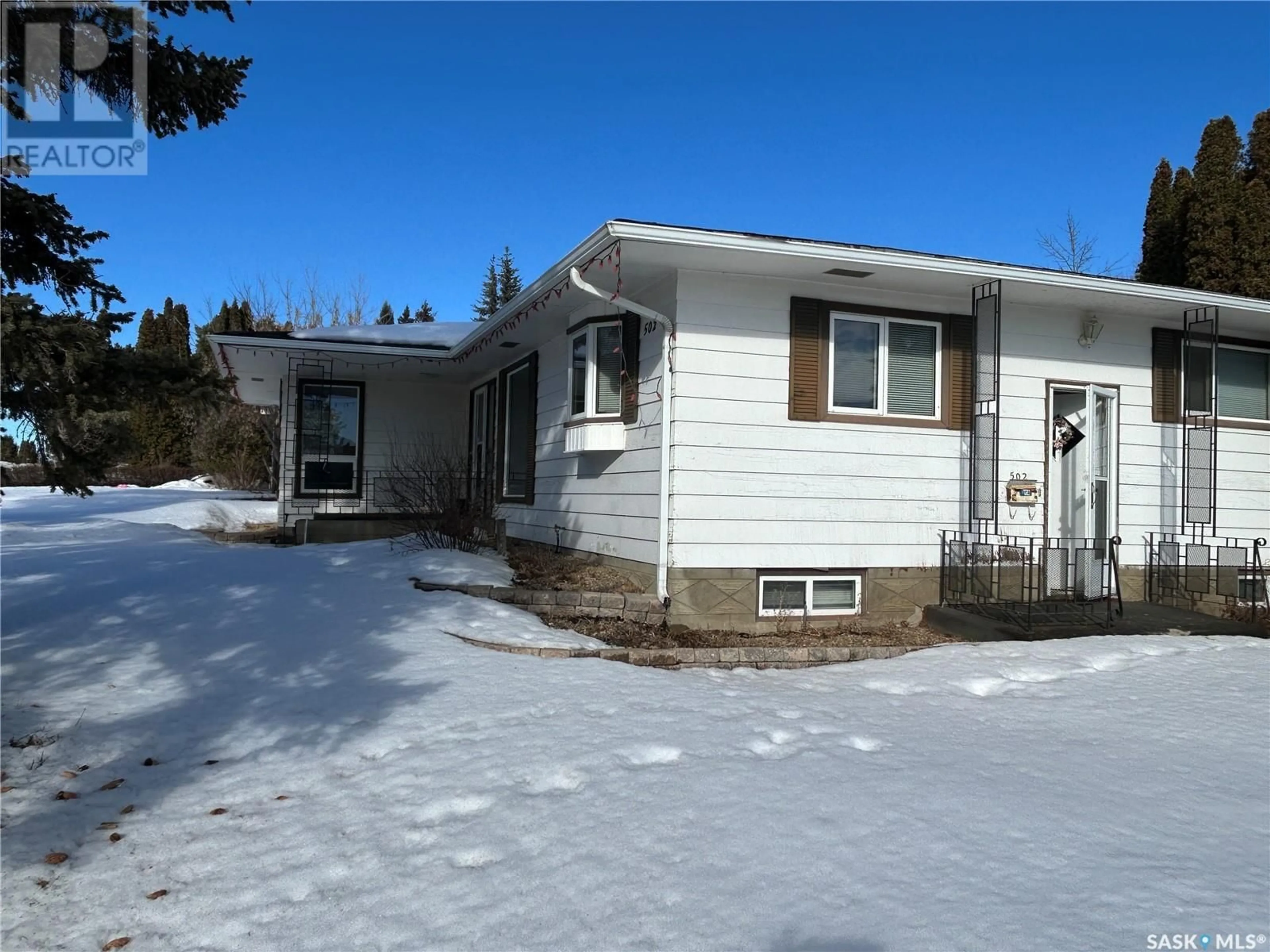 Home with vinyl exterior material, street for 502 100th STREET, North Battleford Saskatchewan S9A0T4