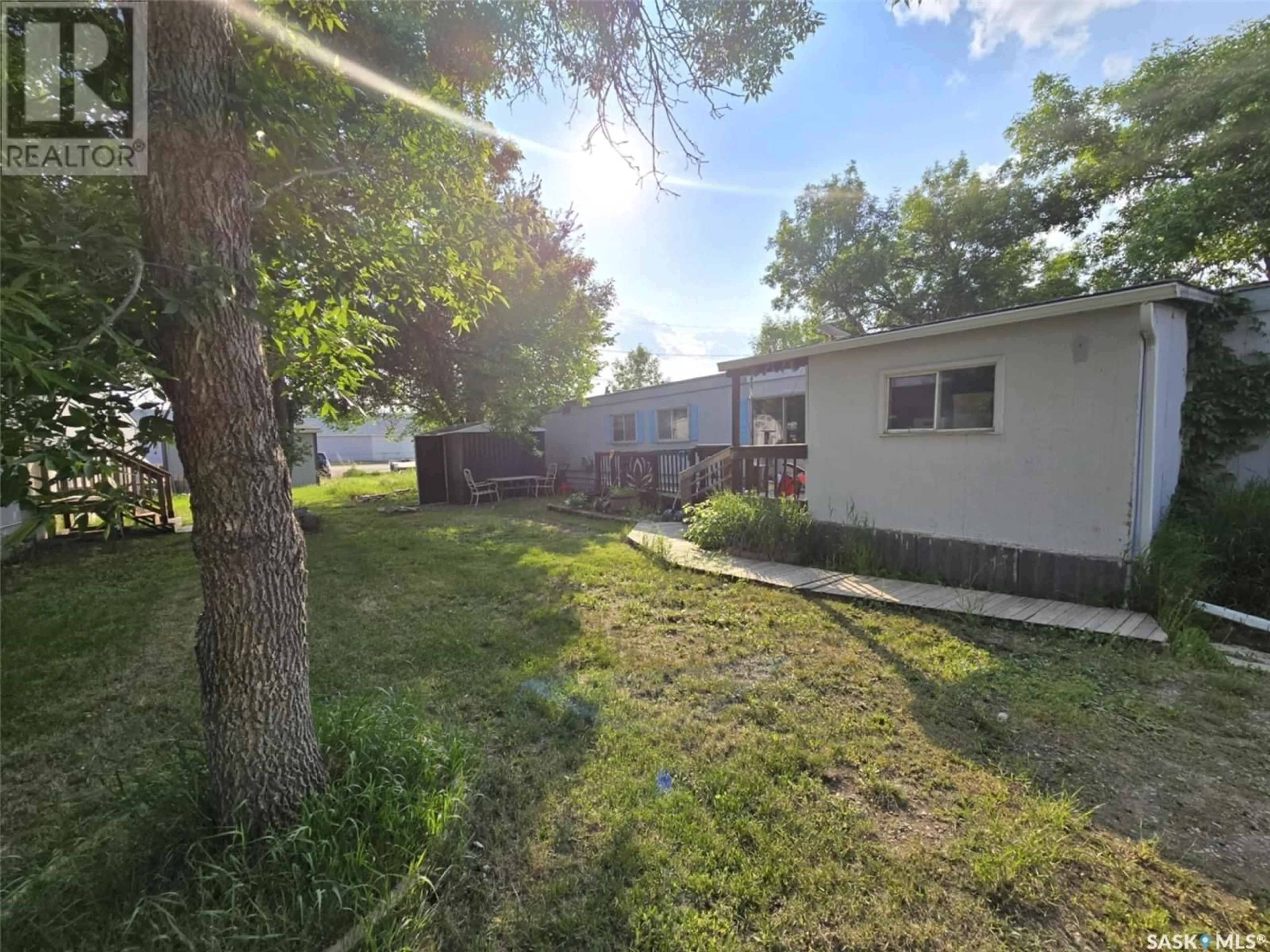 A pic from outside/outdoor area/front of a property/back of a property/a pic from drone, street for 106 LARCH STREET, Caronport Saskatchewan S0H0S0