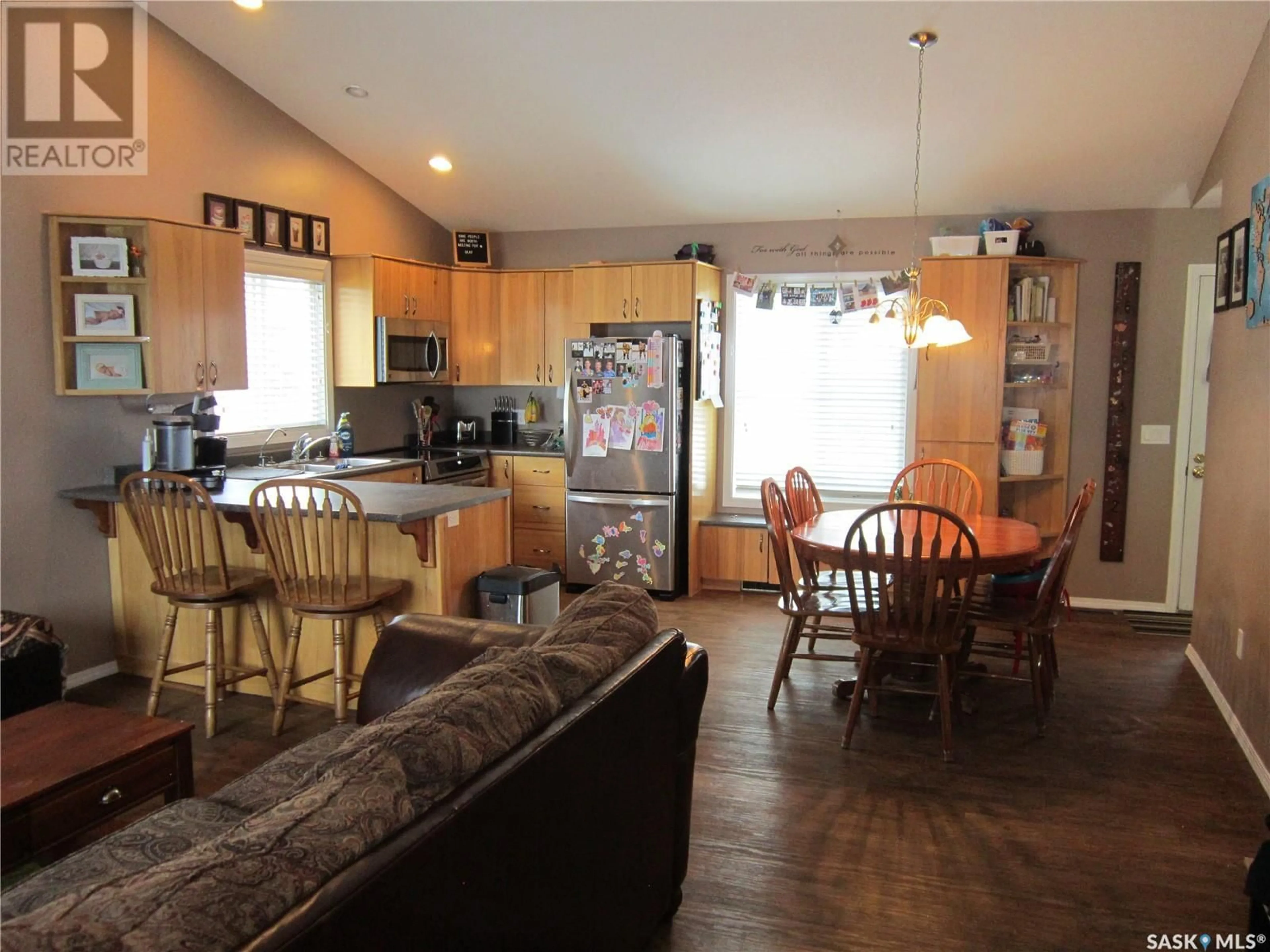 Open concept kitchen, wood/laminate floor for 335 RUTTLE AVENUE, Kinistino Saskatchewan S0J1H0