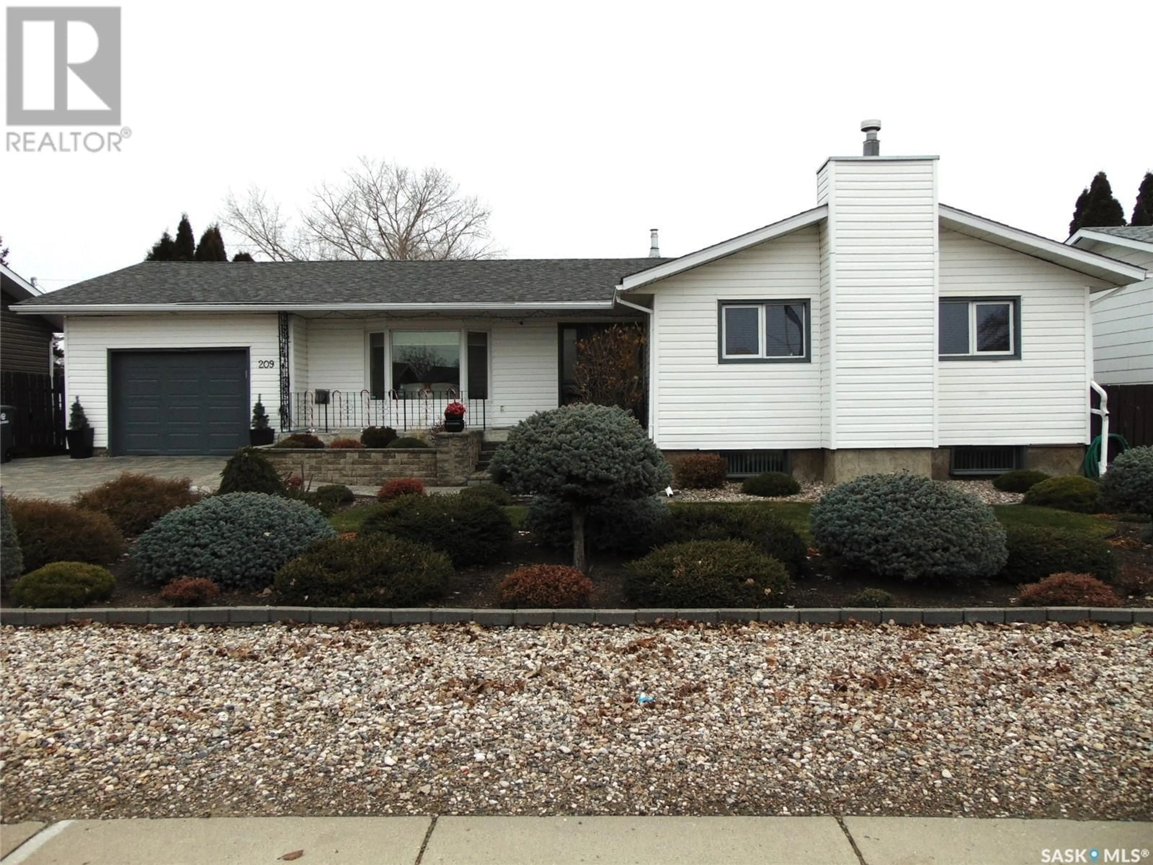 Home with vinyl exterior material, street for 209 1st AVENUE N, Martensville Saskatchewan S0K2T0