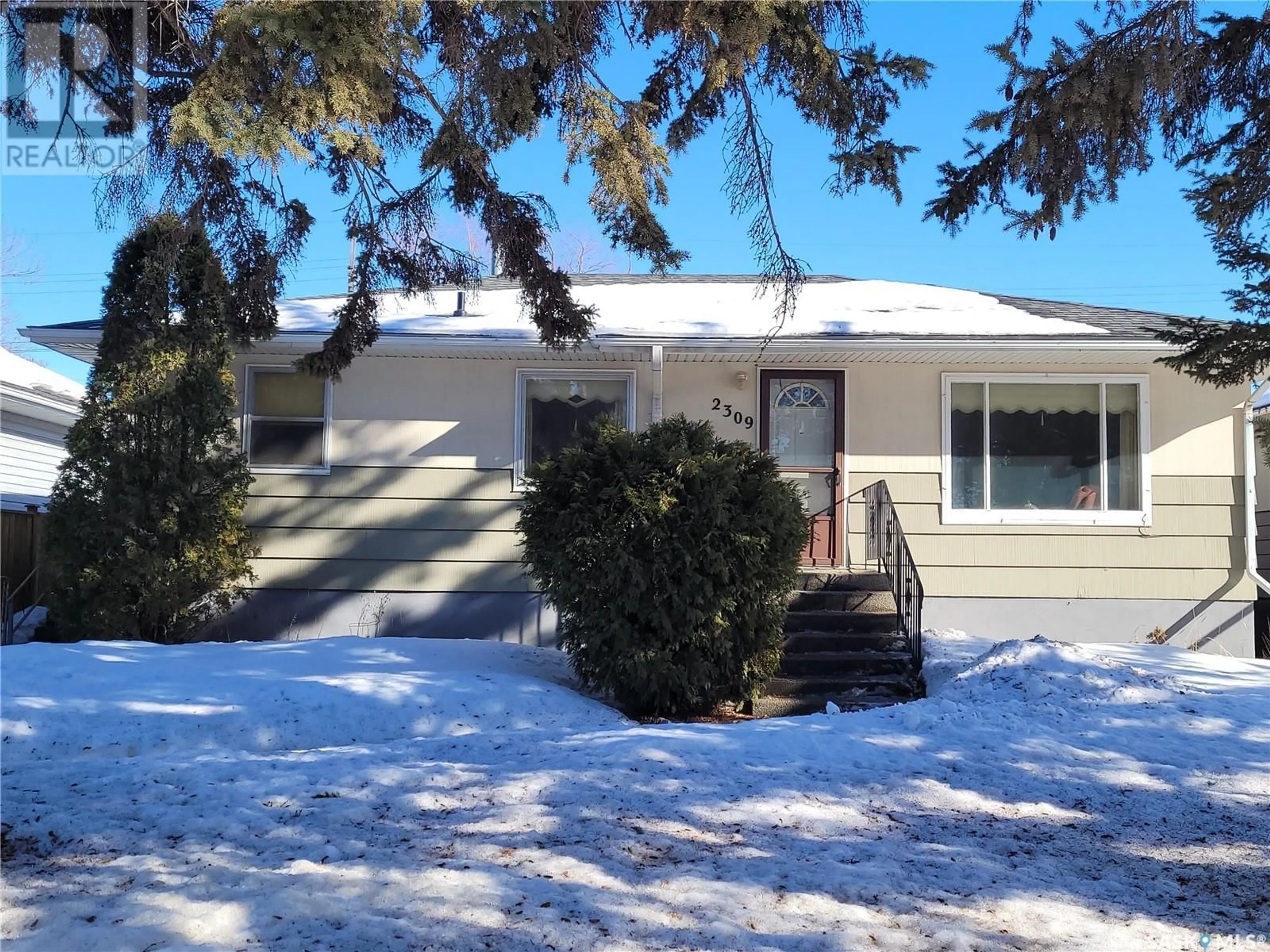 Home with vinyl exterior material, street for 2309 Broadway AVENUE, Saskatoon Saskatchewan S7J0Y7