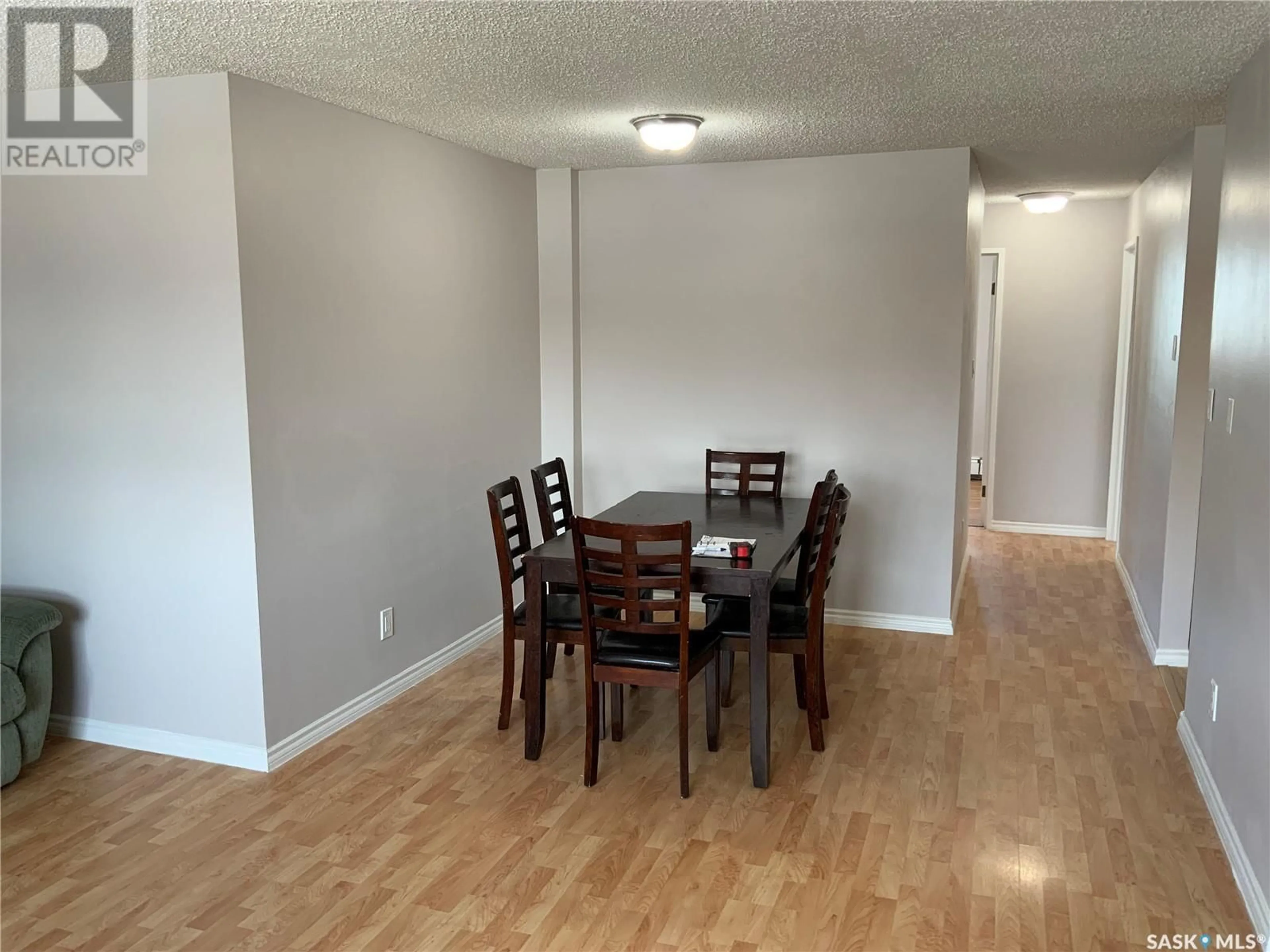 Dining room, wood/laminate floor for 300 415 Tait COURT, Saskatoon Saskatchewan S7H5L3