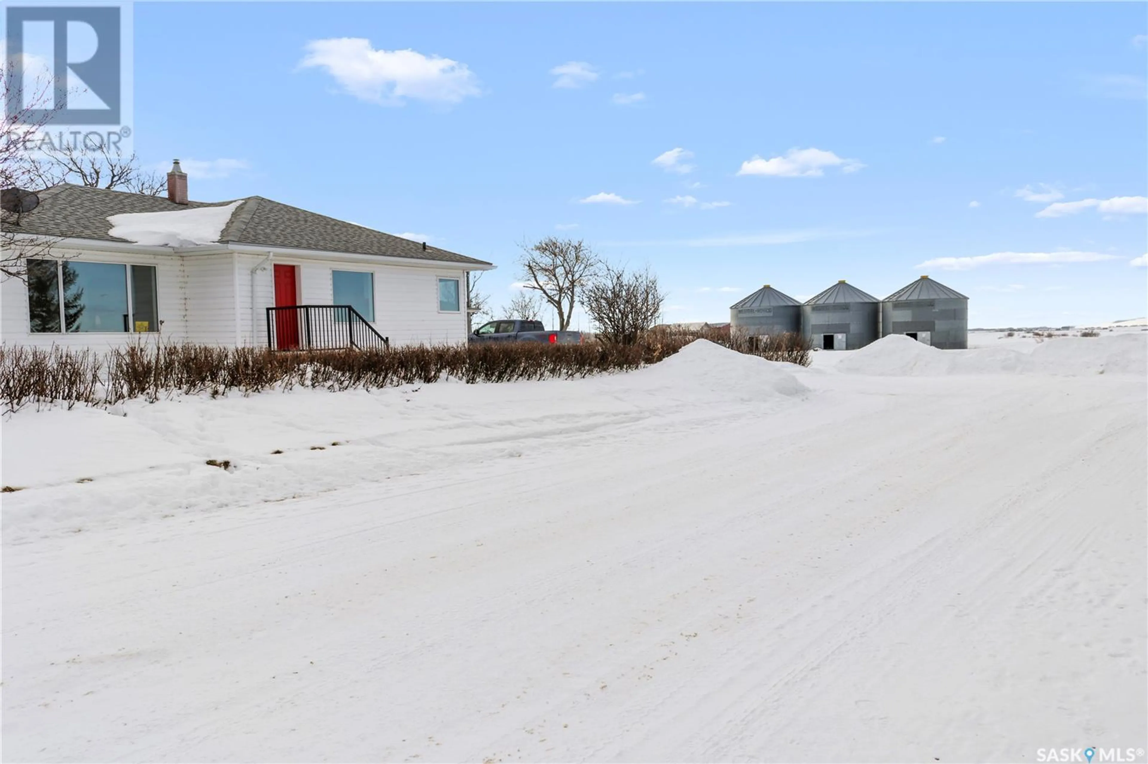 A pic from outside/outdoor area/front of a property/back of a property/a pic from drone, street for Fecyk Acreage, Fish Creek Rm No. 402 Saskatchewan S0K0A6